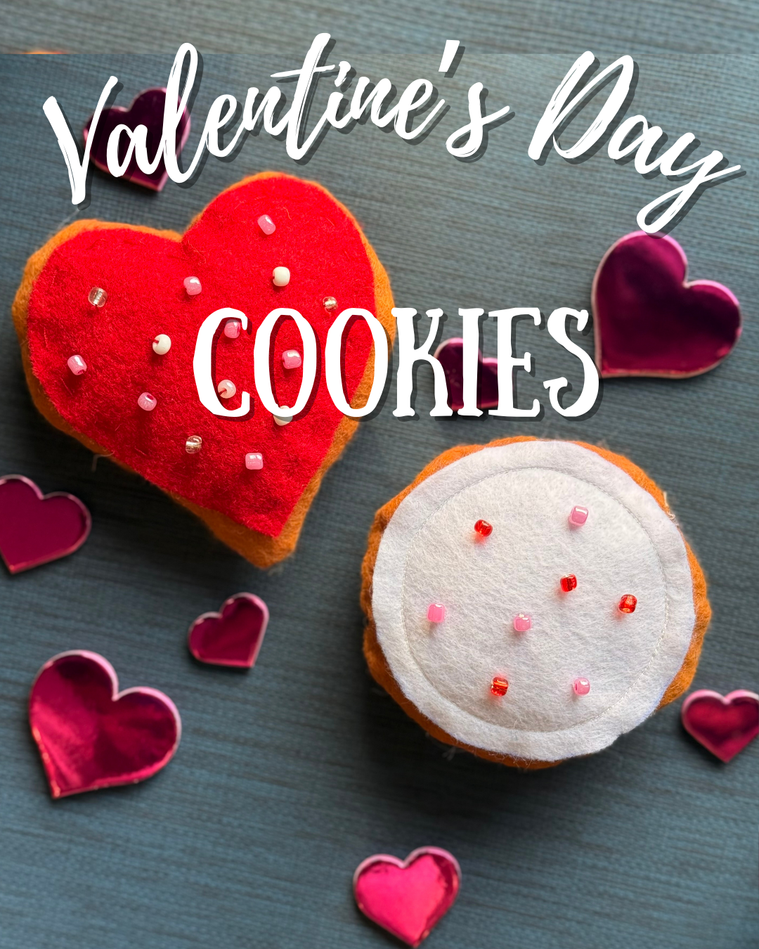 Easy to sew Valentine's Day themed plush cookies with heart shapes, one red with small beads and pink candies, and one white with red beads and pink candies, surrounded by small pink and red heart decorations.