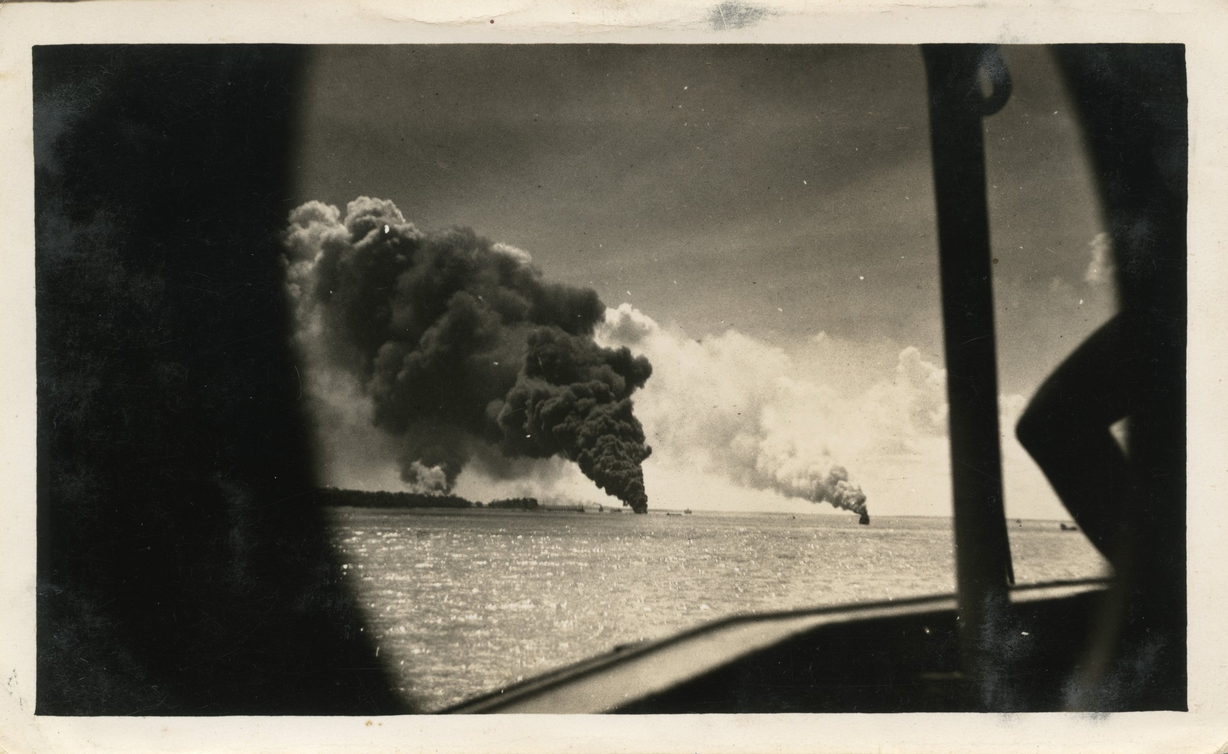 Ships burning in Darwin Harbour, after the Bombing of Darwin, 1942. Source: Northern Territory Library