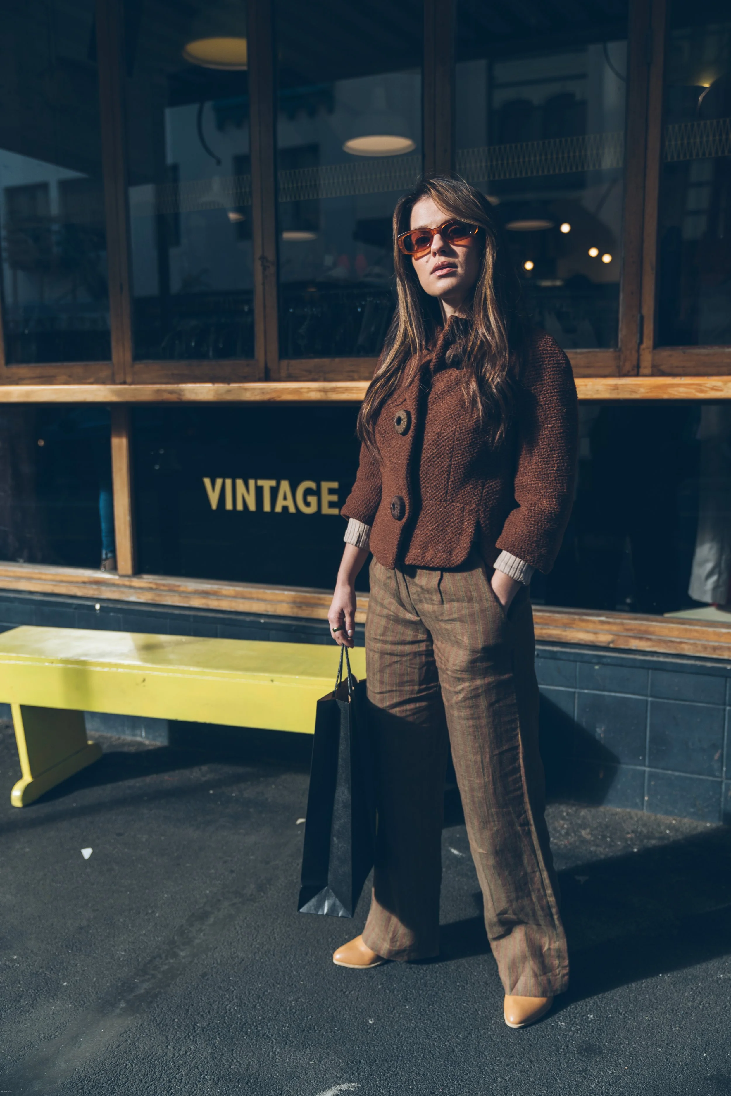 Carrie Rad shopping for vintage clothing on Cuba Street in Wellington, New Zealand, one of the city's best neighborhoods for boutique shopping, cafés, and local fashion.
