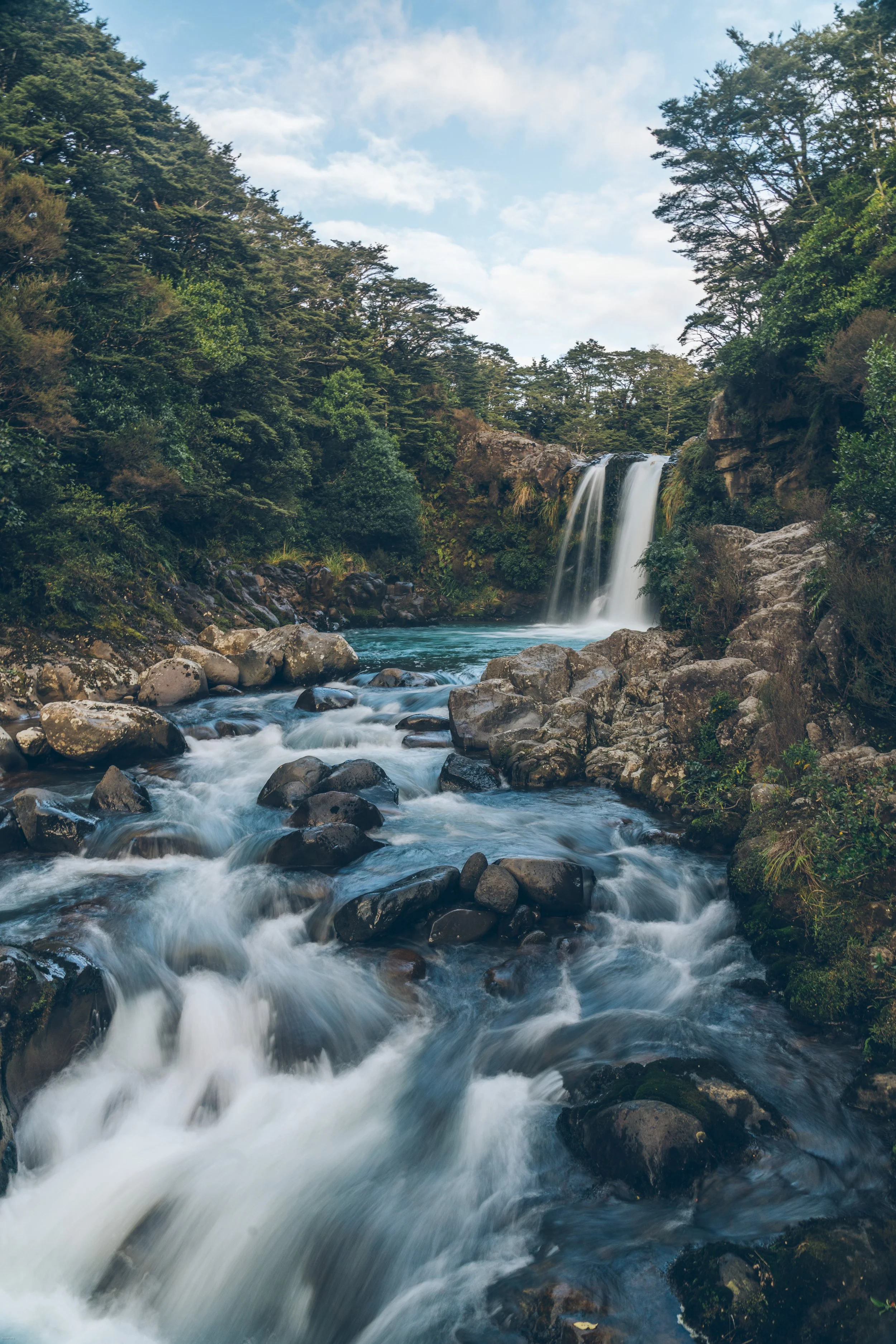 Gollum's Pool waterfall in Tongariro National Park, a beautiful swimming hole and filming location near the Tongariro Alpine Crossing on New Zealand's North Island.
