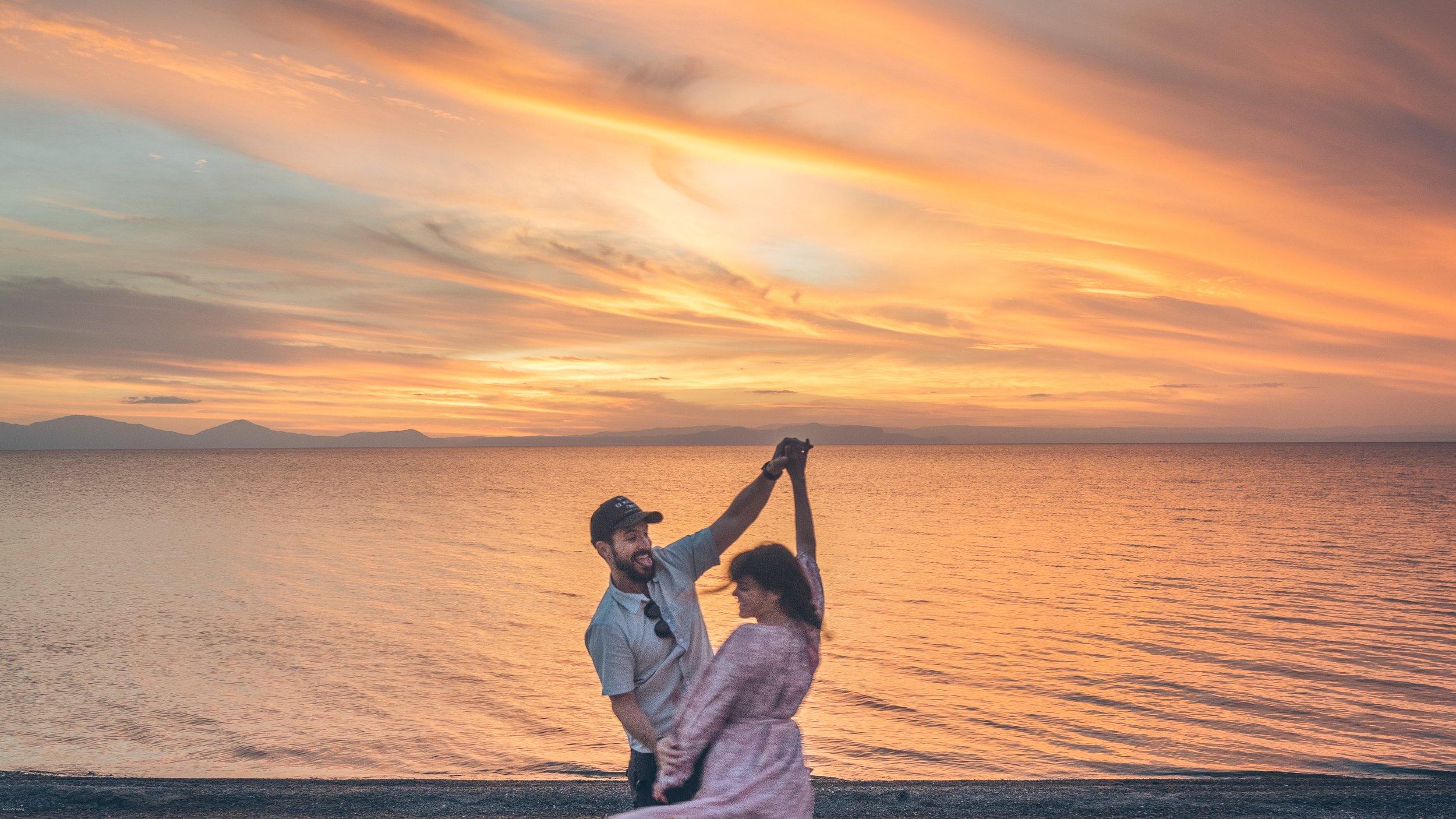 Alexander Ayling and Carrie Rad enjoying sunset on the shores of Lake Taupō, New Zealand's largest lake and one of the highlights of a North Island road trip.