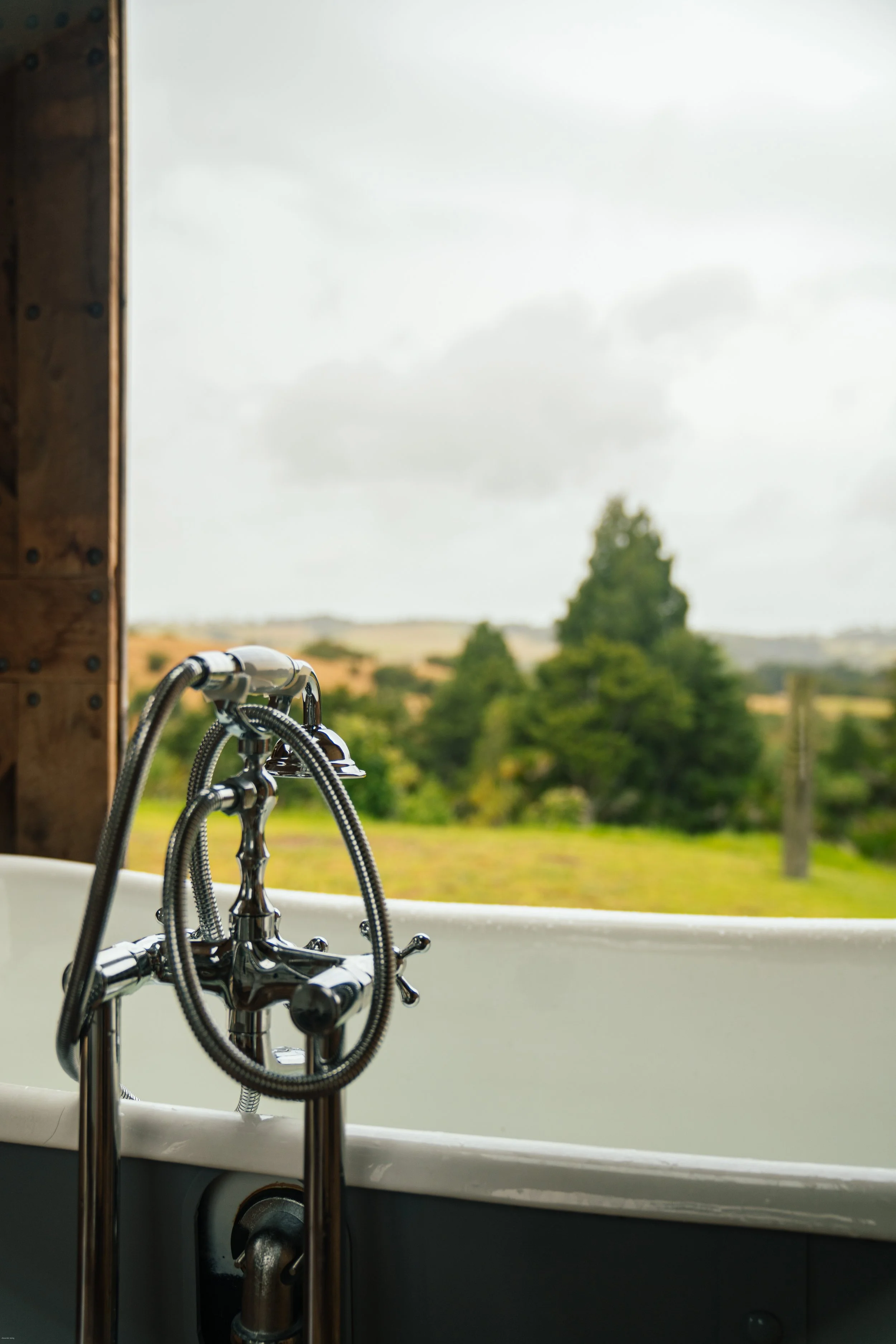 The beautiful outdoor bathtub with a view in Mangawhai Heads, Northland, New Zealand.