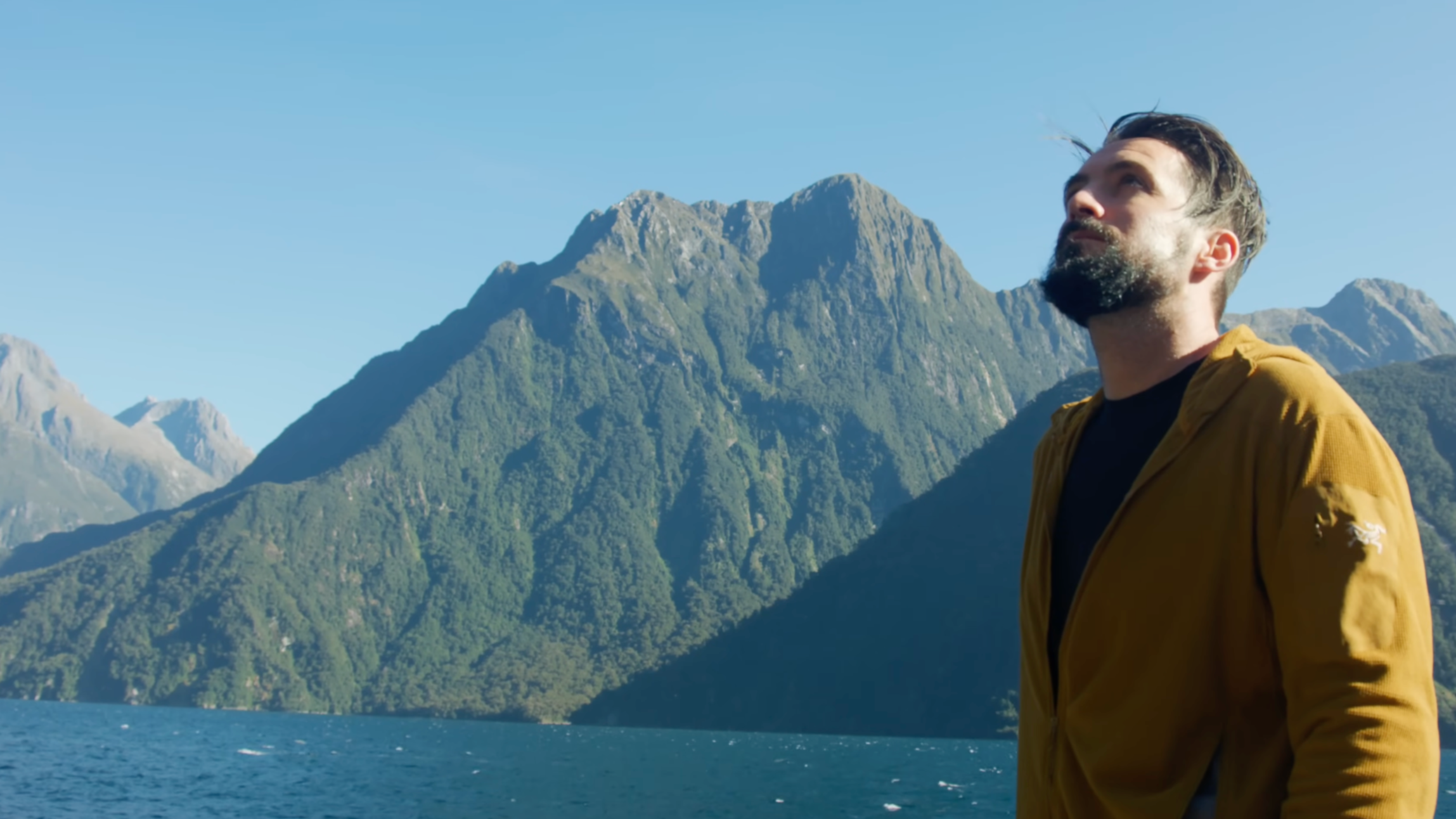 Alexander Ayling overlooking Milford Sound in Fiordland National Park, one of New Zealand's most spectacular fjords and a highlight of any South Island itinerary.