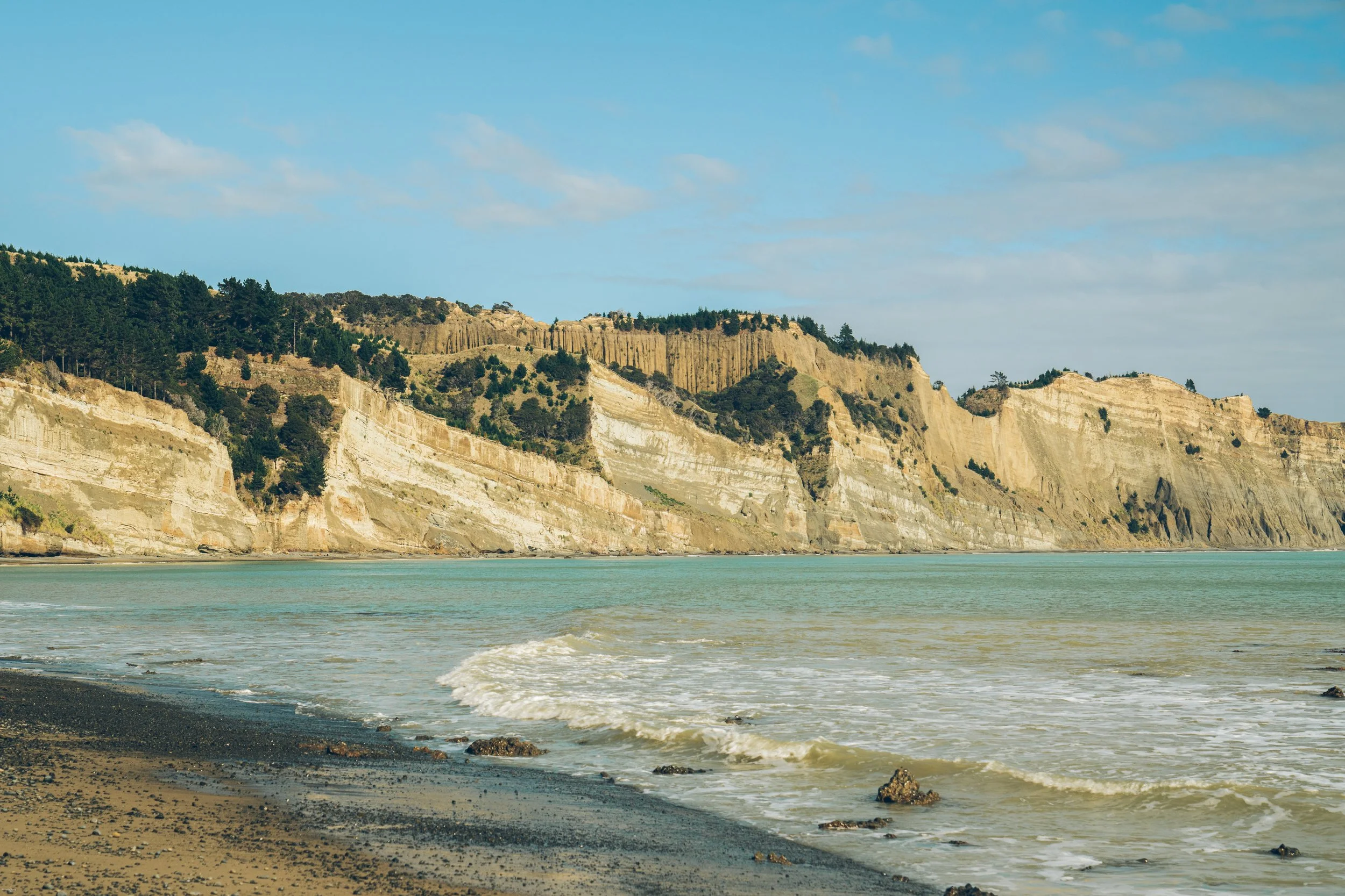 Dramatic coastal cliffs at Cape Kidnappers in Hawke’s Bay, New Zealand, viewed from the beach below the world-famous Cape Kidnappers Golf Course.