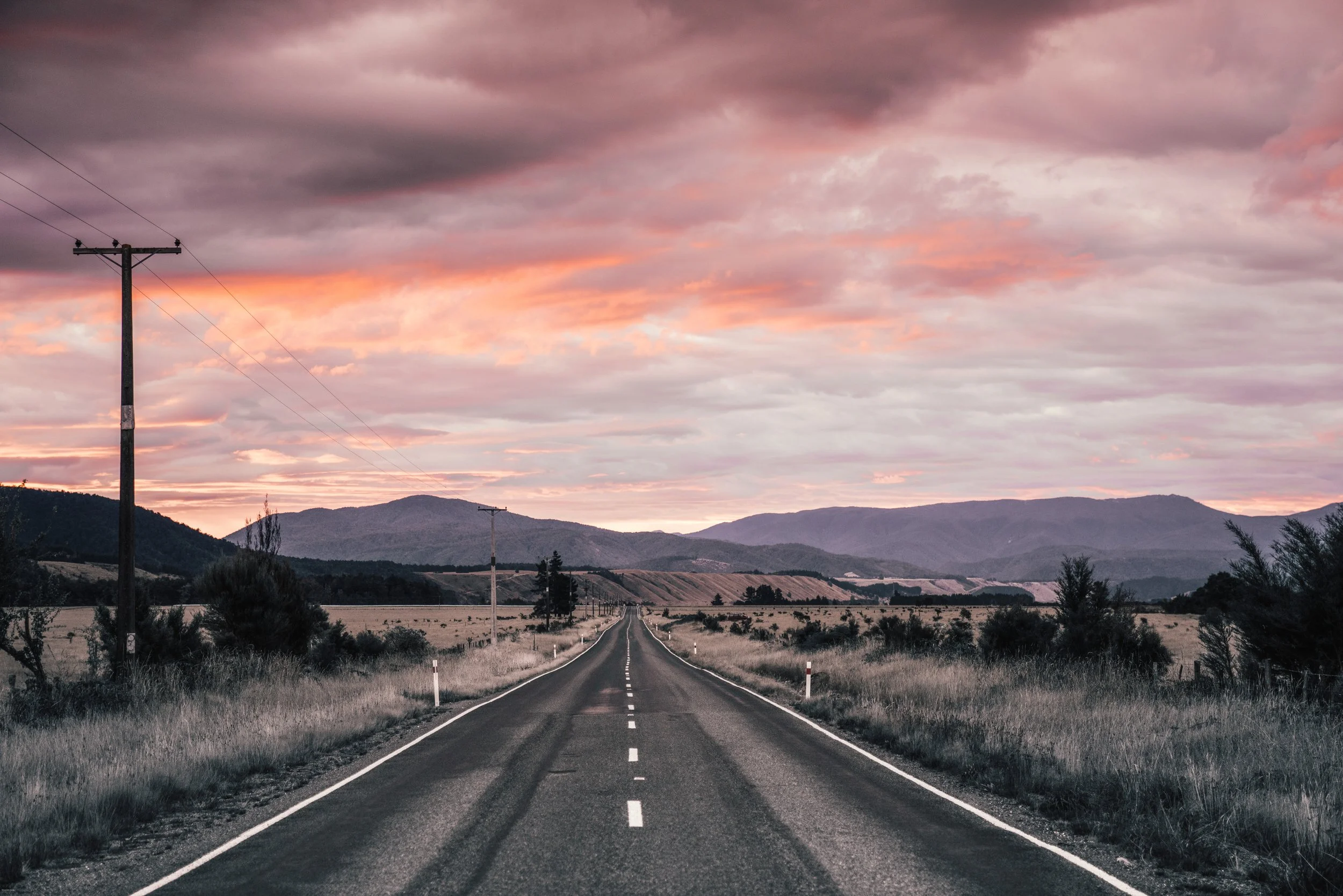 Stunning Pink Sunset on the road trip to Nelson Lakes National Park, South Island, New Zealand.