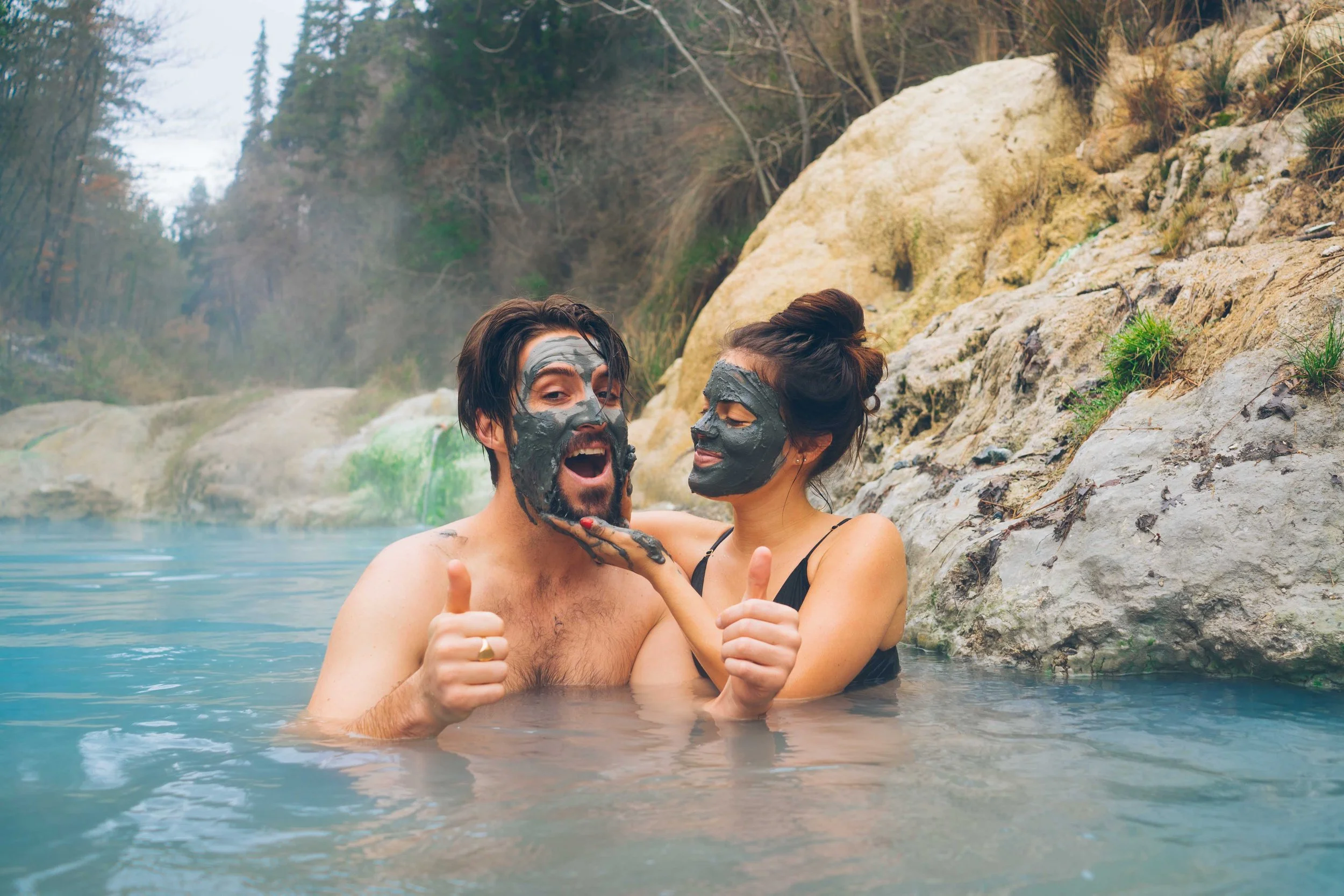 Alexander Ayling and Carrie Rad enjoying a natural hot spring in rural Tuscany.