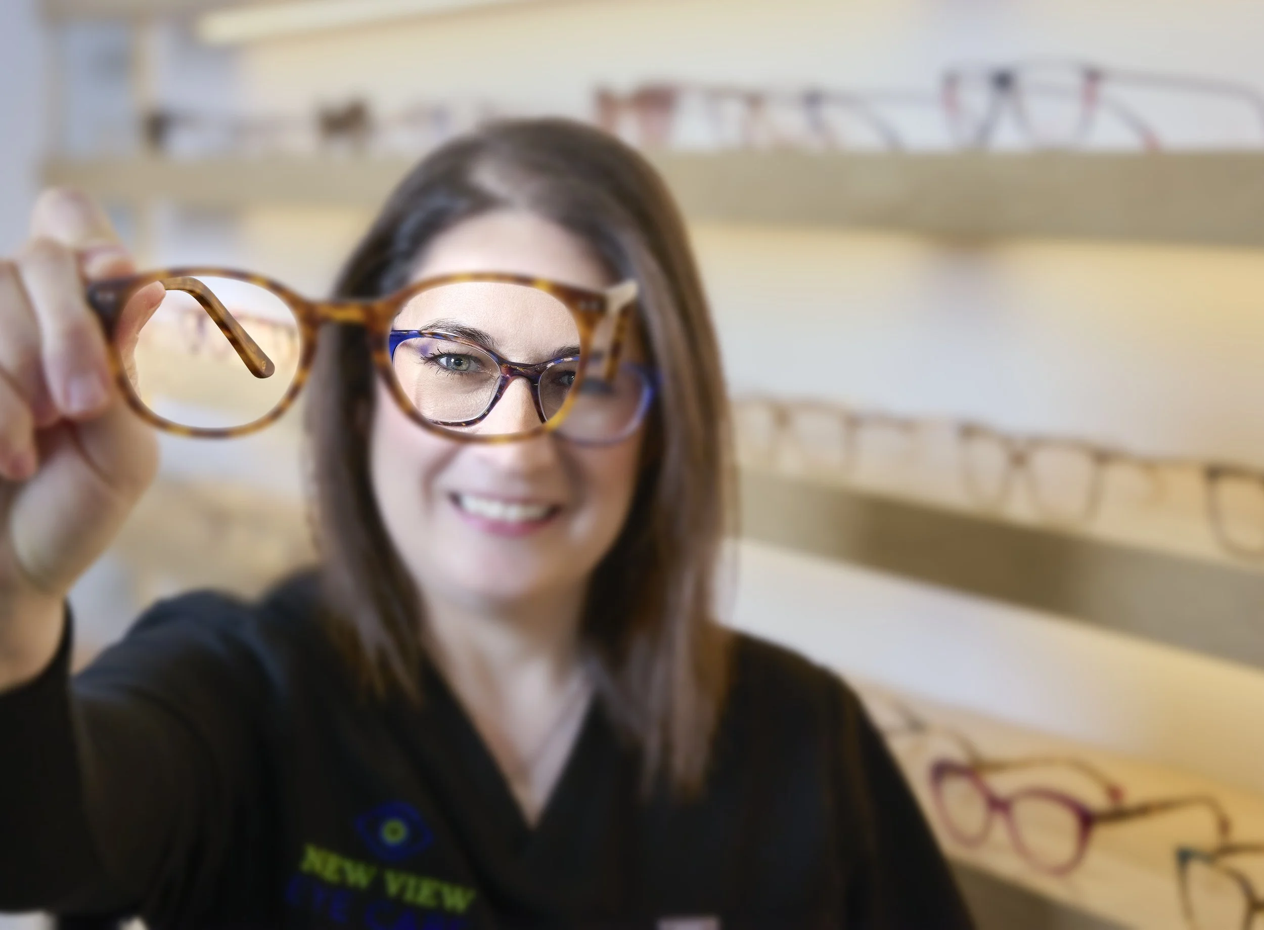 Doctor holding up eyeglasses