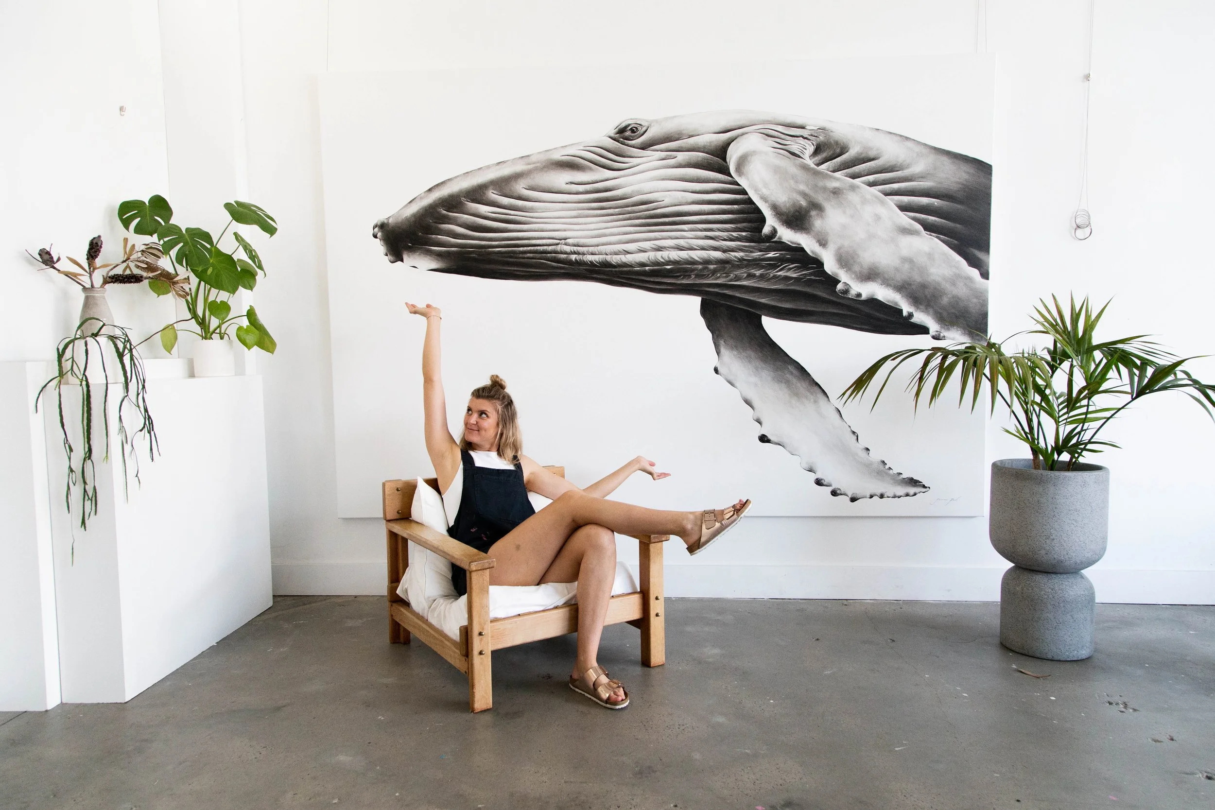 Artist, Jaimee Paul with her giant humpback whale painting - creating art for purpose