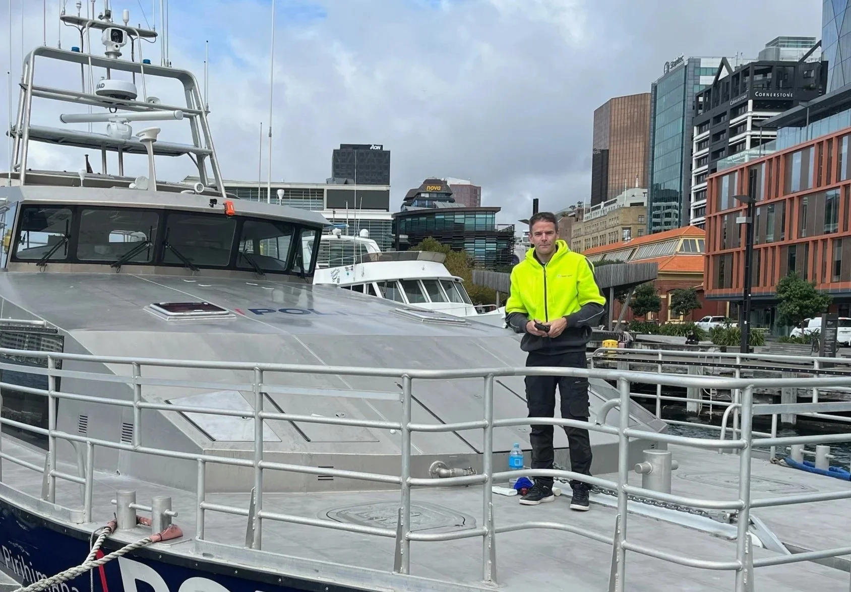 Glass restoration specialist from Glass Genius standing on a maritime vessel in Wellington after completing glass restoration and NanoGlass Protection.