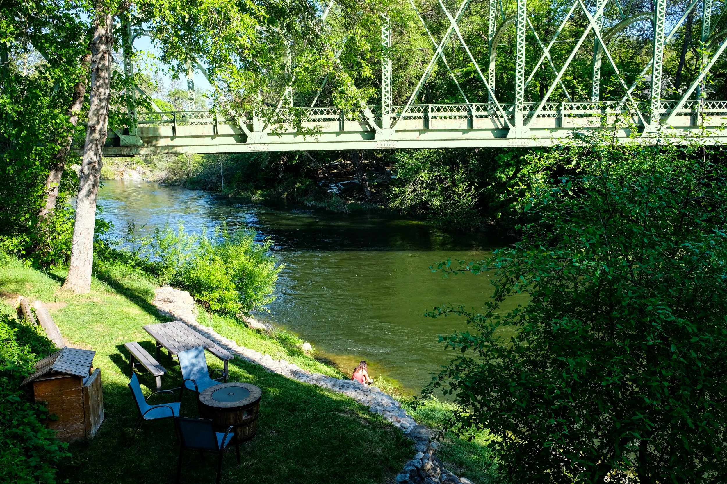 Girl playing by a river.