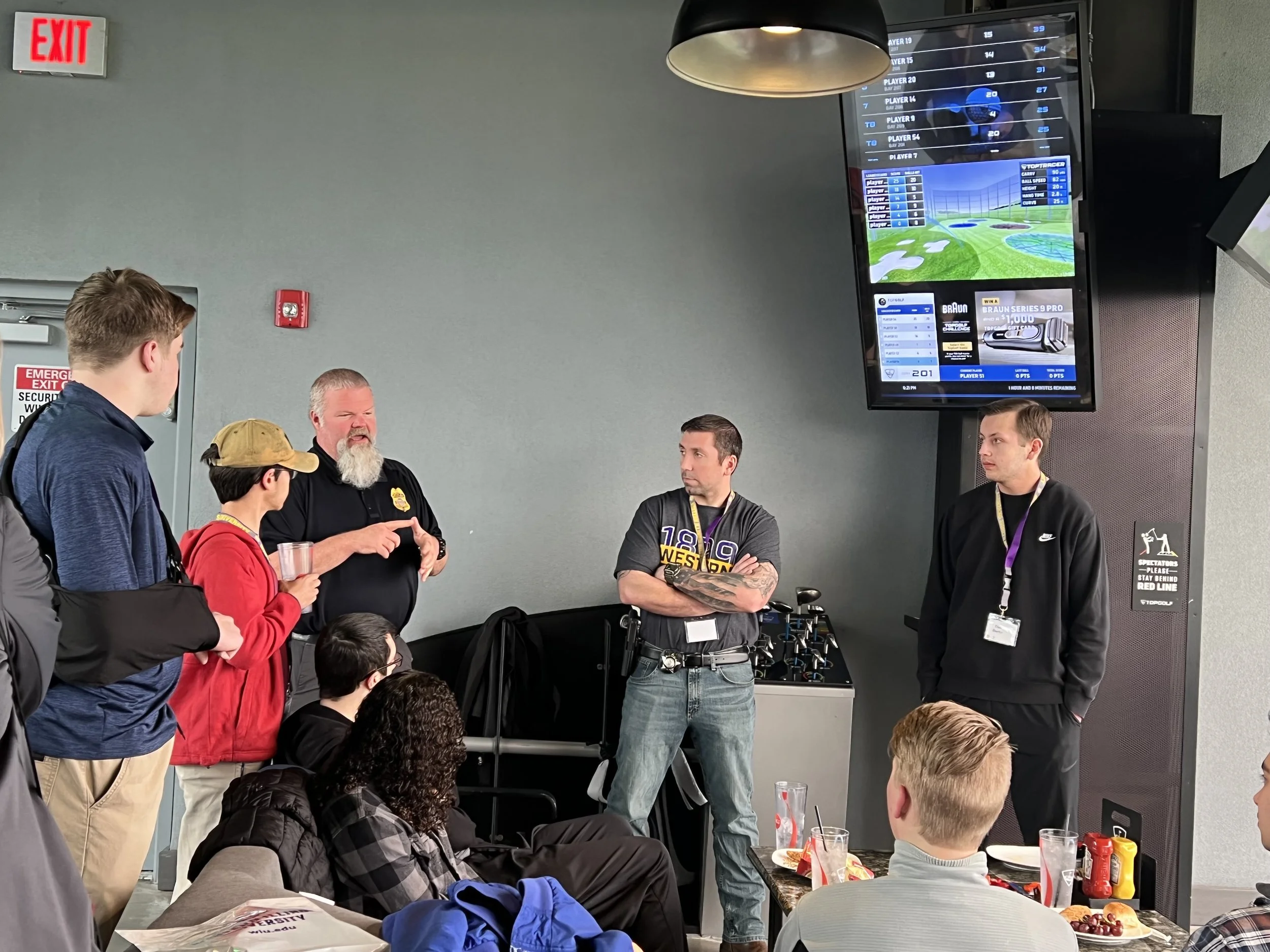 Criminal Justice alumni talking with potential students.