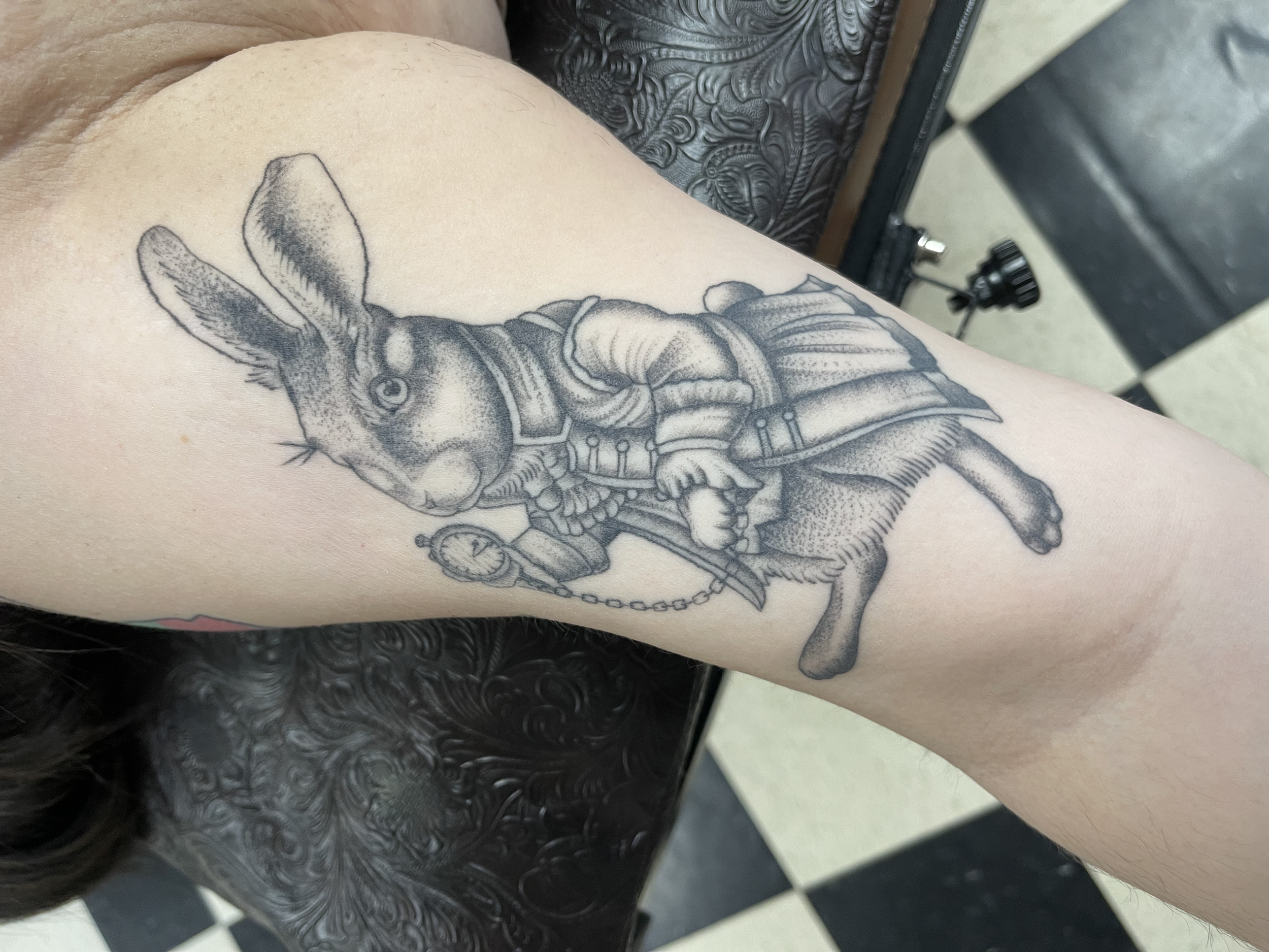 Tattoo of a rabbit wearing a vest and holding a pocket watch on a person's forearm. Lubbock's Best Tattoo Shop
Traditional tattoo shop Lubbock 
 