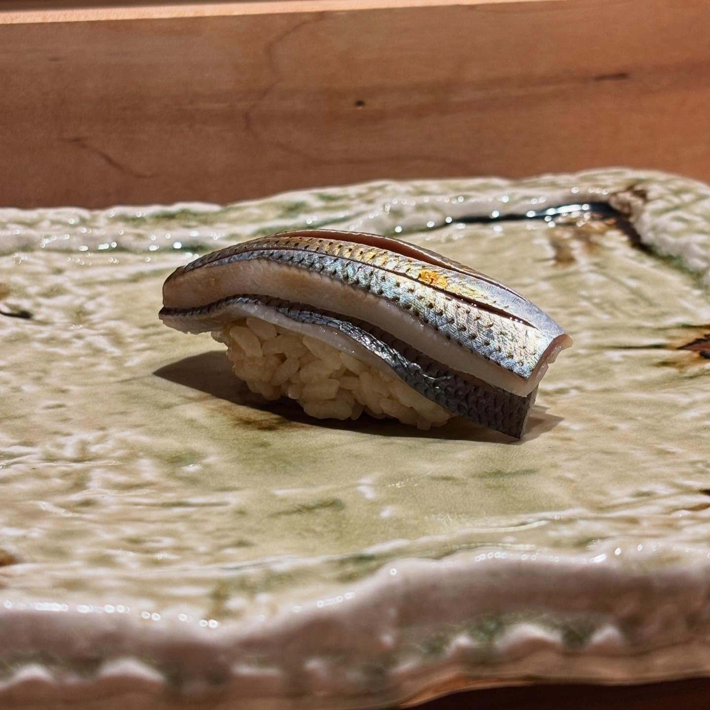 Kohada-gizzard shad. Back in March. Edomae sushi skill show. In our opinion, this piece really tests the Chef&rsquo;s experience, skills, and defined style. #SushiLovers #OmakaseExperience #finedining 
#SushiArt #JapaneseCuisine #SushiTime #sushichef