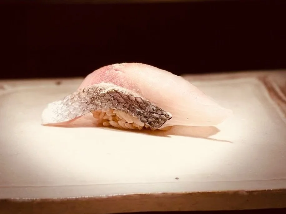 Black sea bream with just a light torch on the skin to bring out that beautiful aroma, while the fish stays rich, oily, and delicate underneath. Chef Jeff shaped this nigiri with a nice plump form, paired with our akazu red vinegar sushi rice.

In Ja