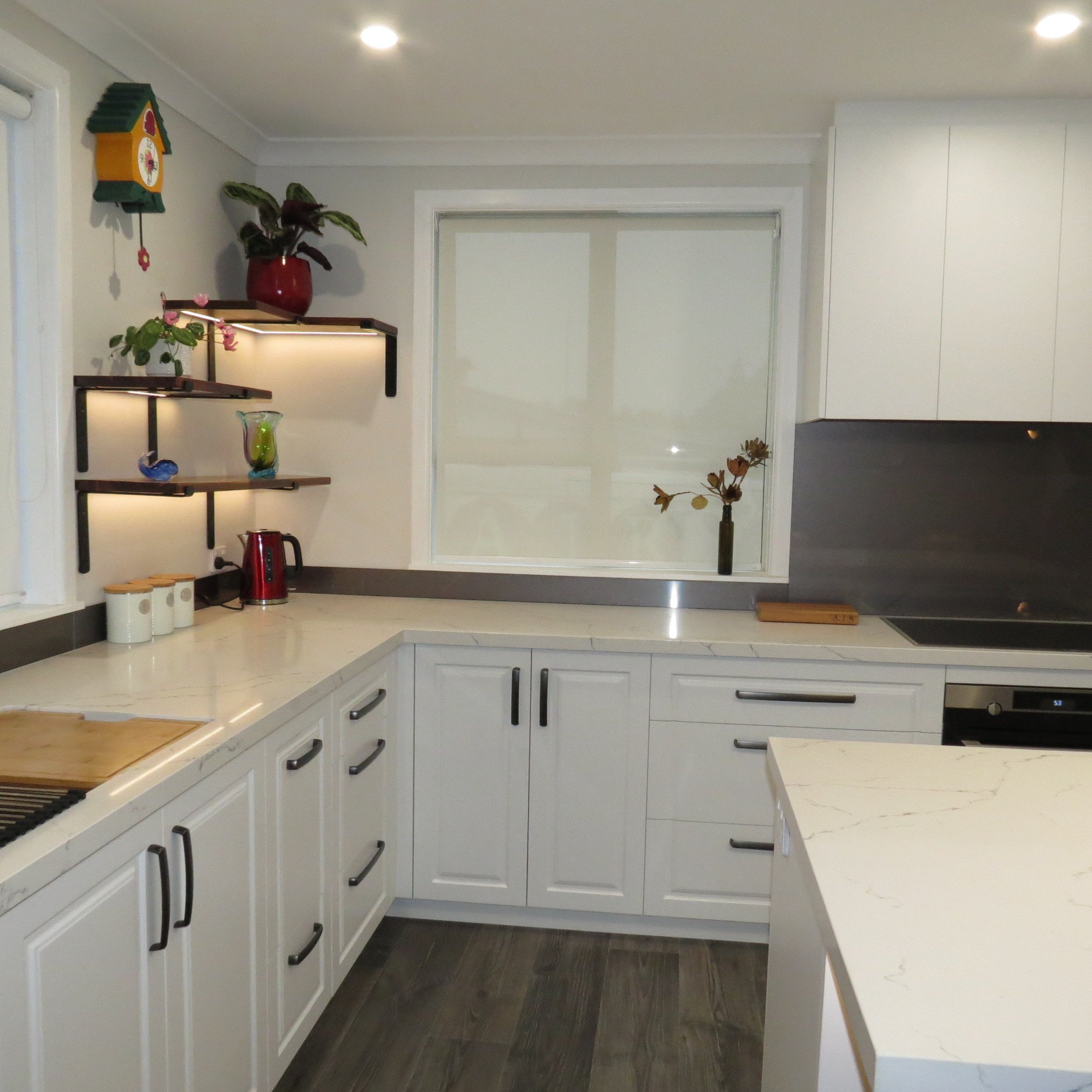 *Bespoke shelves with recessed LED strip lighting
*Benchtop-Prime Stone Finelli Polished 40mm Thick with square edges
*Cabinet fronts-Dezignatek Thermoform Nelson Style in Designer white colour
*Handles-Archant Glenda brushed anthracite mixed lengths