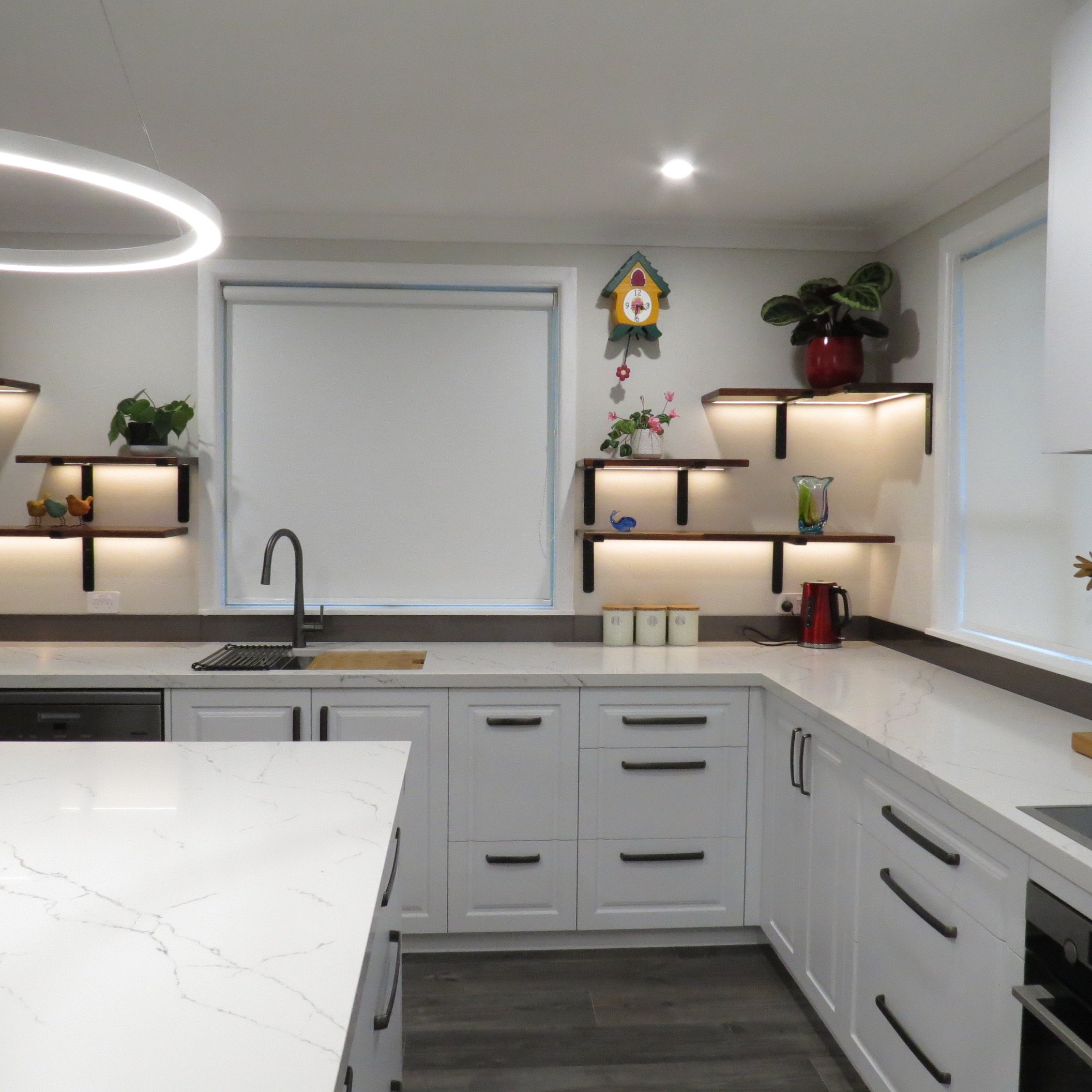 *Bespoke shelves with recessed LED strip lighting
*Benchtop-Prime Stone Finelli Polished 40mm Thick with square edges
*Cabinet fronts-Dezignatek Thermoform Nelson Style in Designer white colour
*Handles-Archant Glenda brushed anthracite mixed lengths