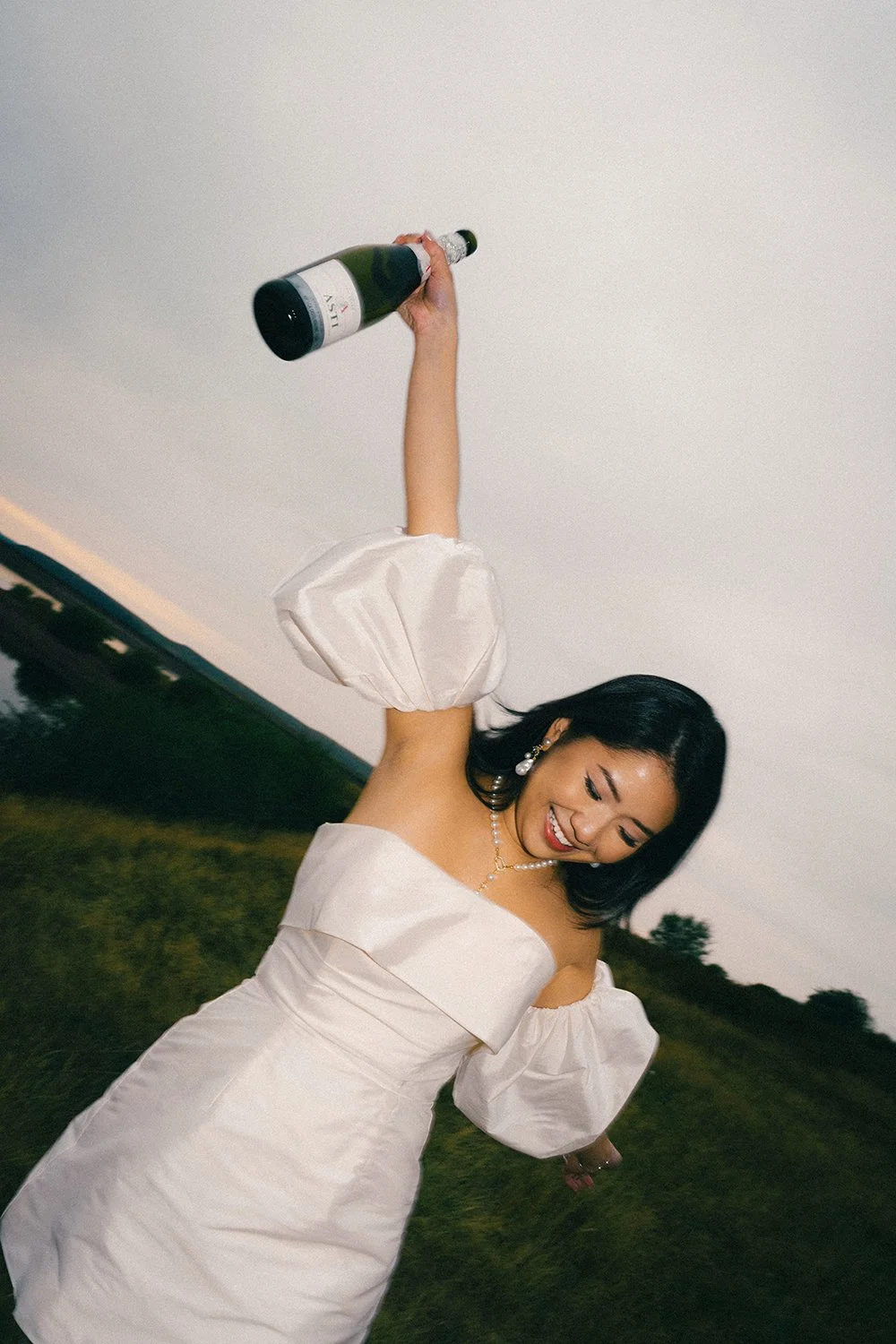 Bridal with Champagne for Nicole and Kaiden engagement at blue hour at Scout Moor Wind Farm