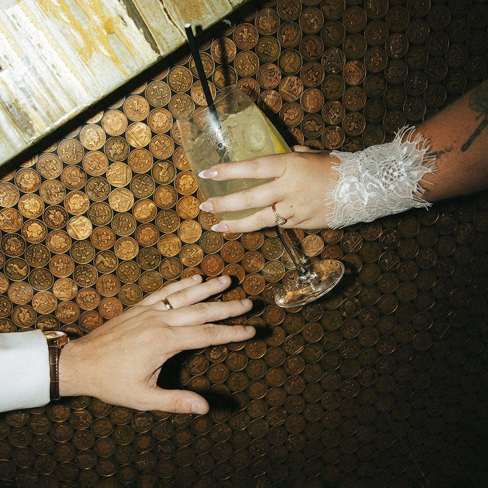 Wedding rings and cocktail hour details at a wedding reception.