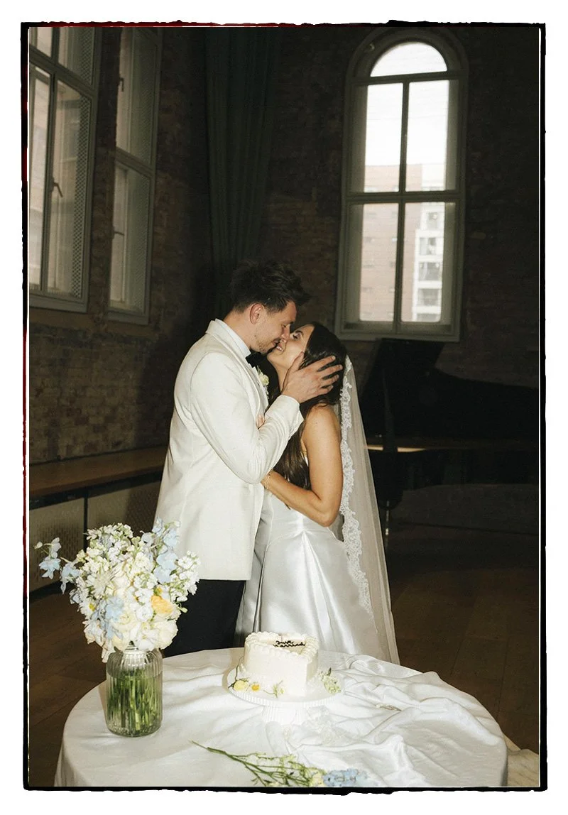 Cutting cake for for Hannah & Jake's classic white wedding at Halle St Peter’s, Manchester