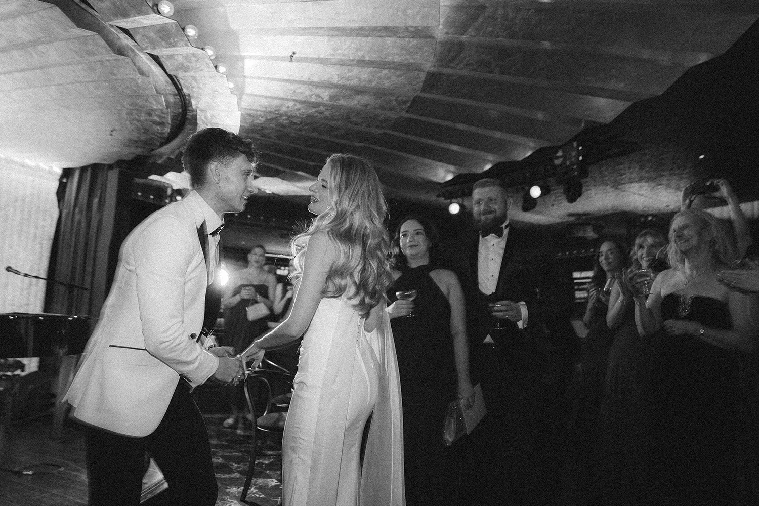 The first dance for Lucy and Oliver's black tie wedding reception at Louis Restaurant Manchester