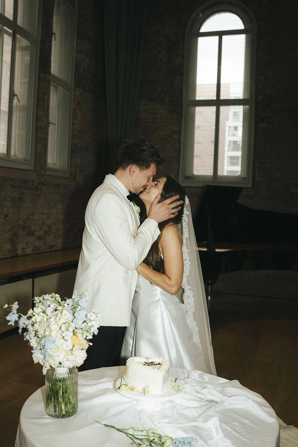 Cake cutting for for Hannah & Jake's classic white wedding at Halle St Peter’s, Manchester