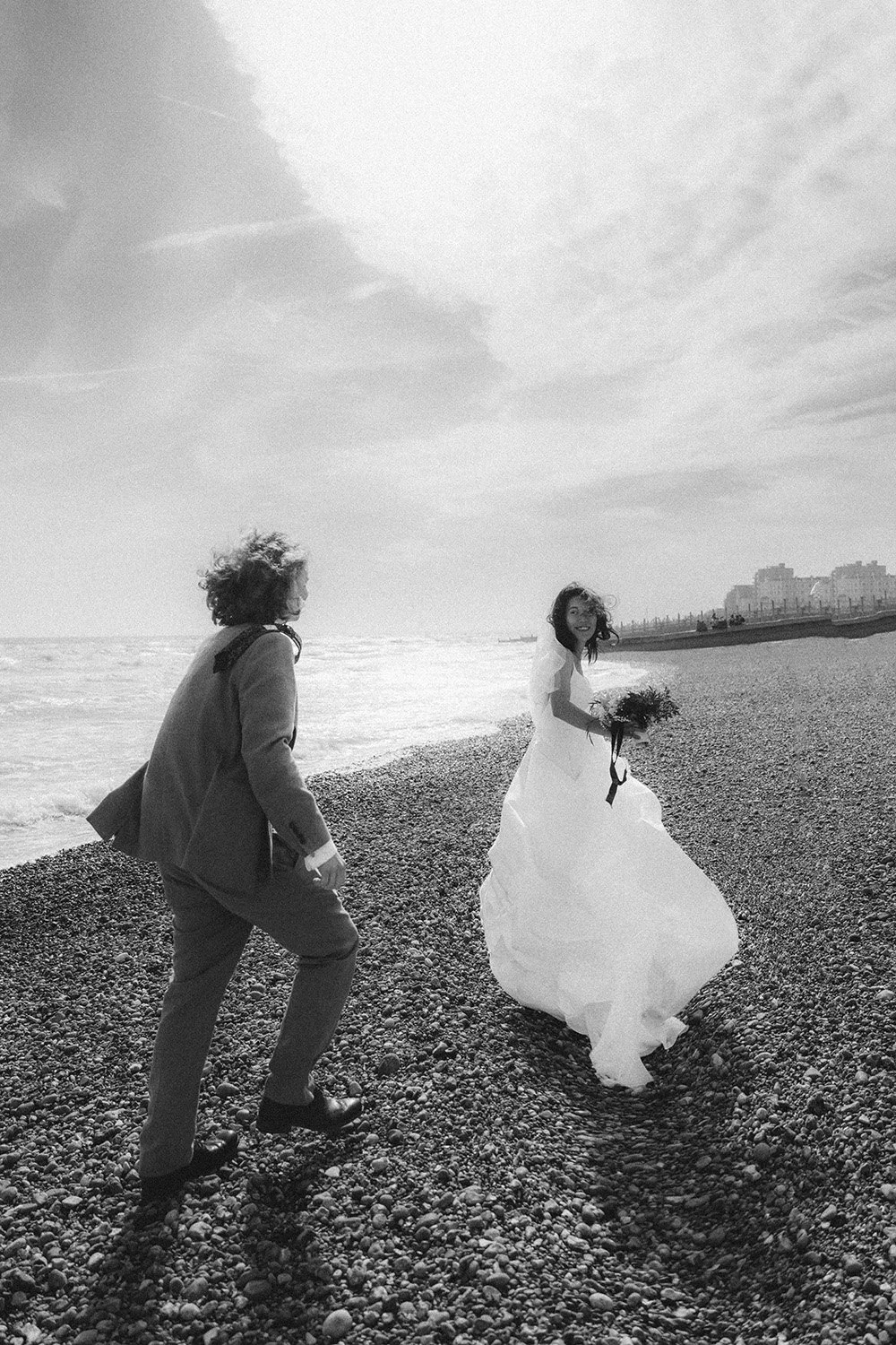 Lydia & Mort running on the beach for their wedding at for Lydia & Mort at Brighton