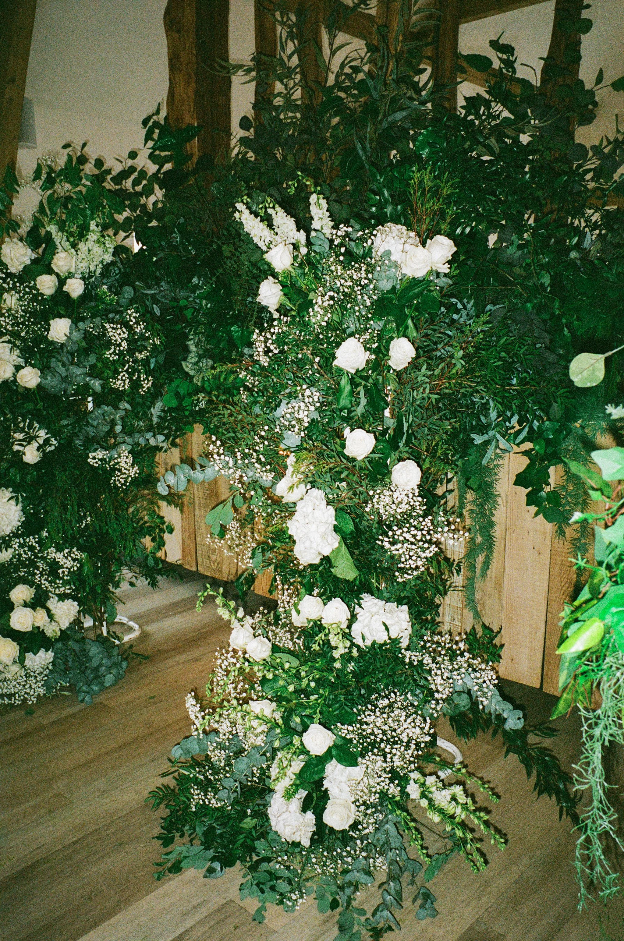 Stylish florist ceremony settup in classic white for Georgina &Joe's wedding at The River Barn Lancashire