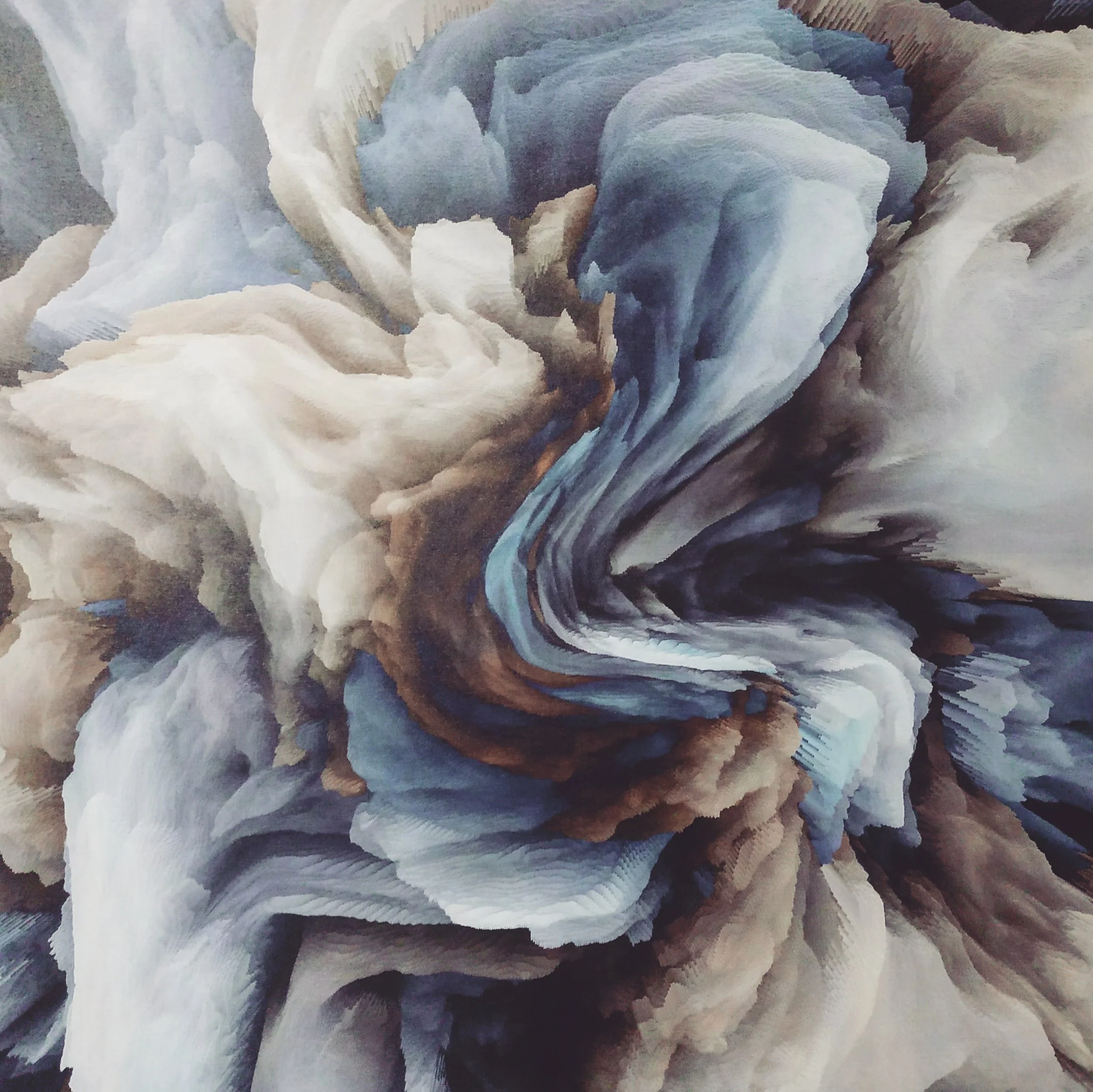 Abstract swirling pattern of cream, light blue, dark blue, black, and brown colors.