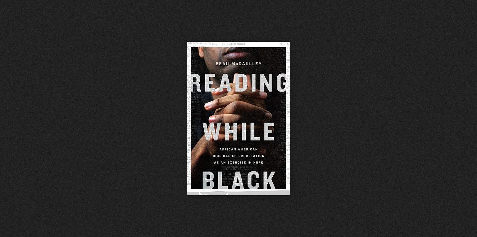 Book cover titled 'Reading While Black' by Esau McCaulley, featuring a close-up of a person with clasped hands.