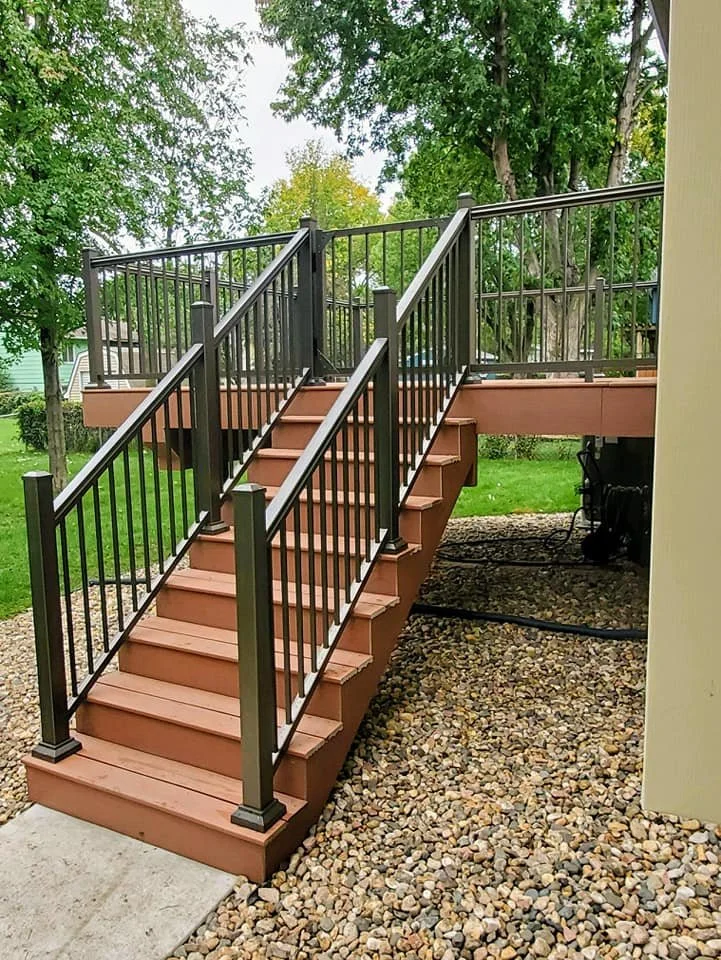 Brandon, SD Composite Deck with Aluminum Railing reflects a stunning reddish brown color.