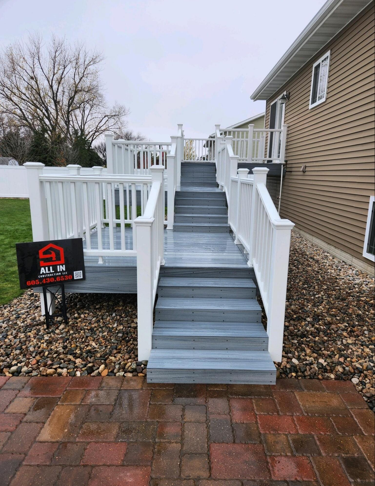 Brookings, SD Trex Island Mist Composite Triple Platform Deck with White Railing...Simply Stunning.