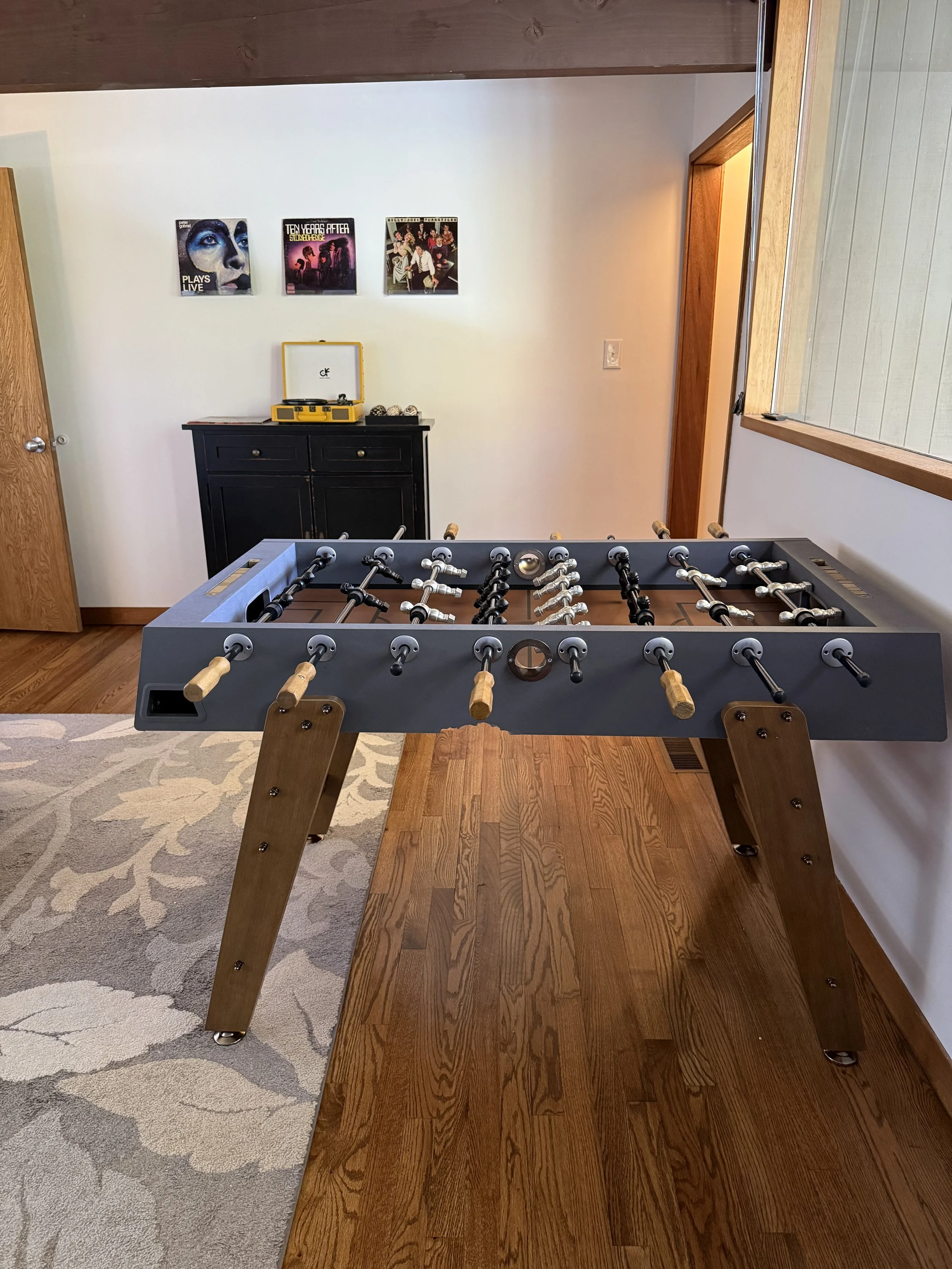 Professional foosball table in the lower-level game room