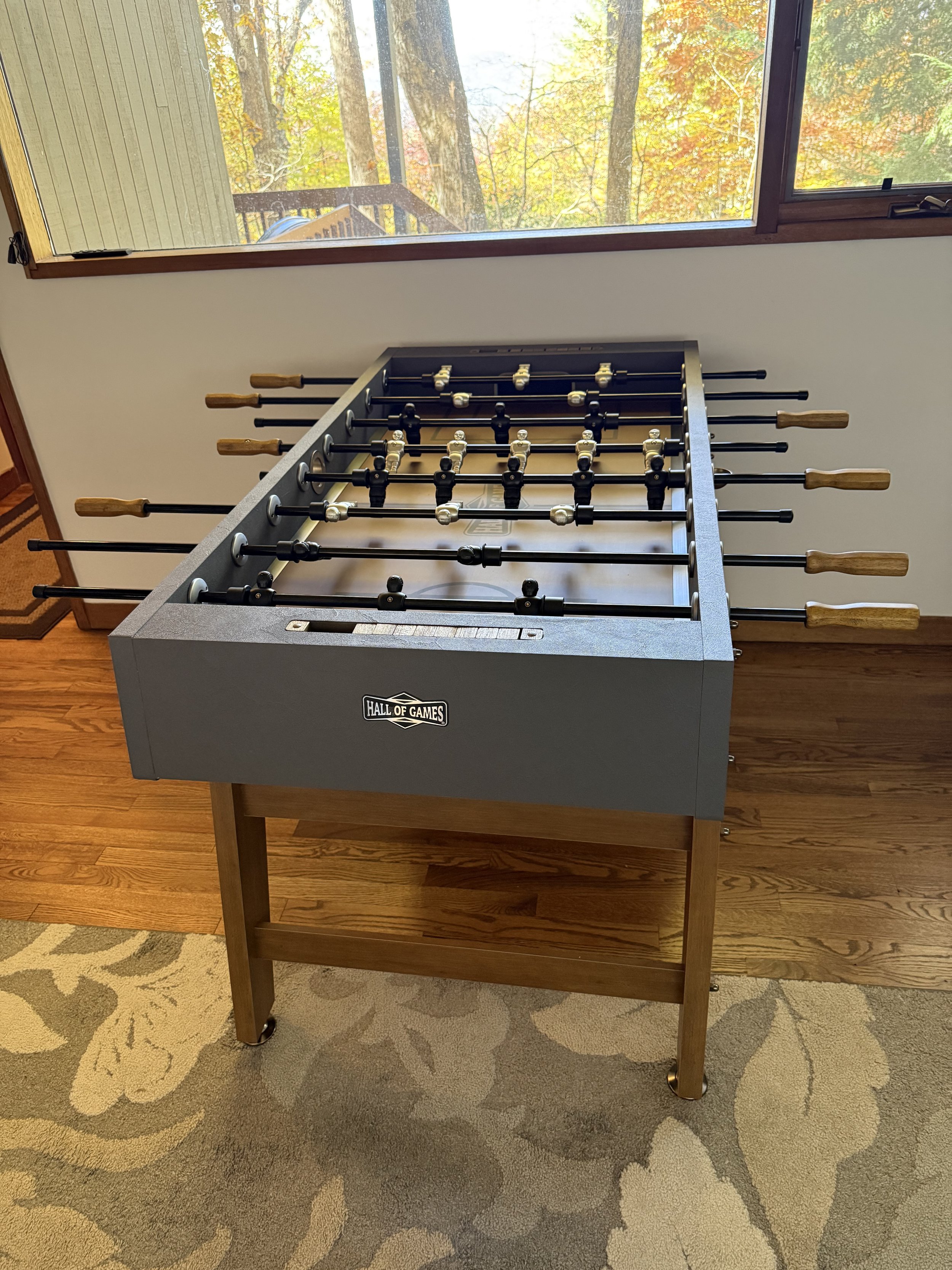 Foosball table centered in the entertainment space