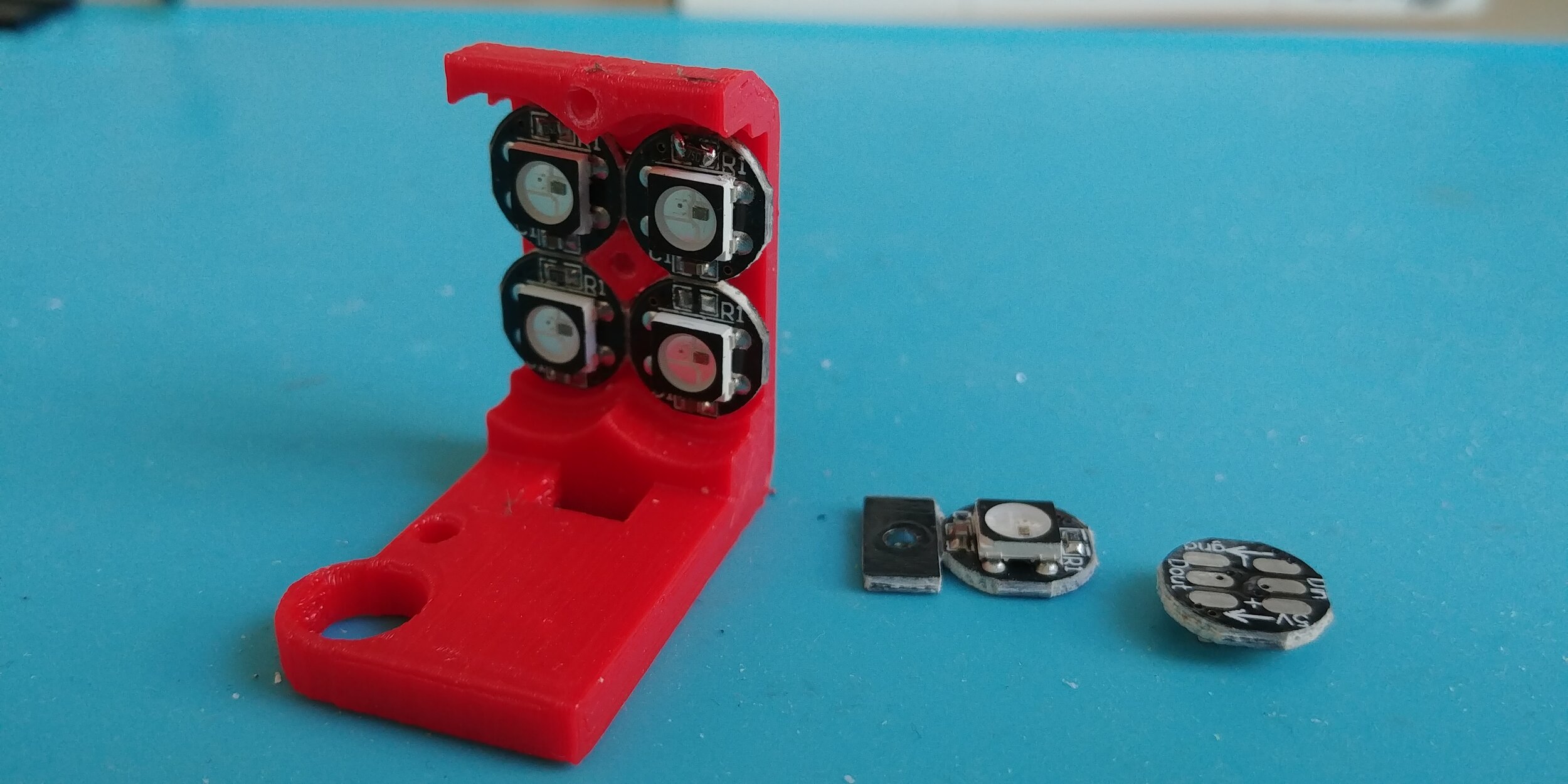 WATTS's eyes are lit with these modular RGB LEDs held in place with a custom bracket.