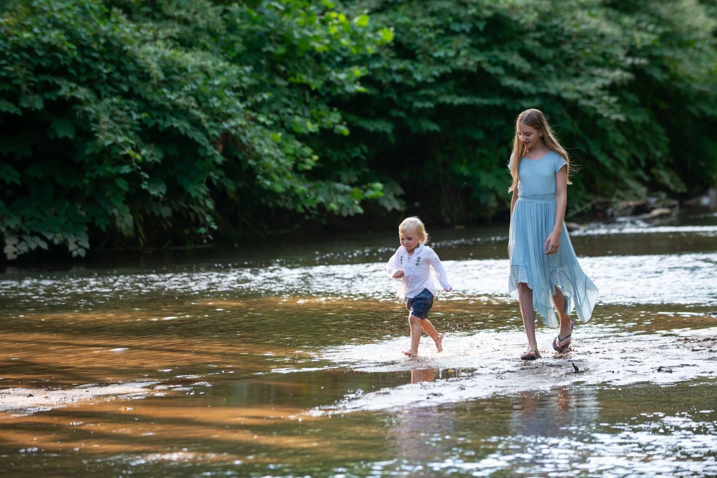 Kids running through Hominy Creek in Asheville
