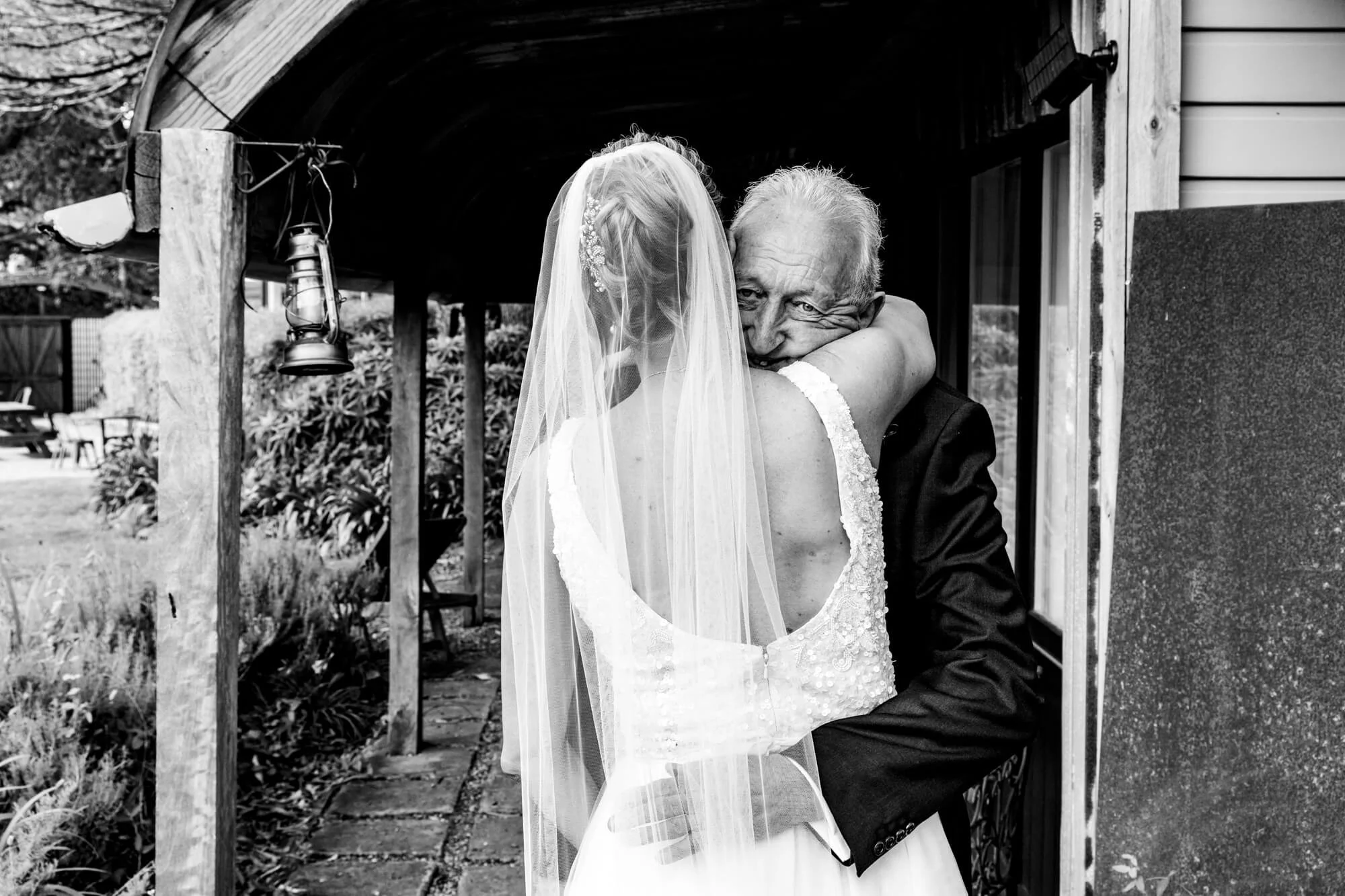 Dad hugging daughter on her wedding day