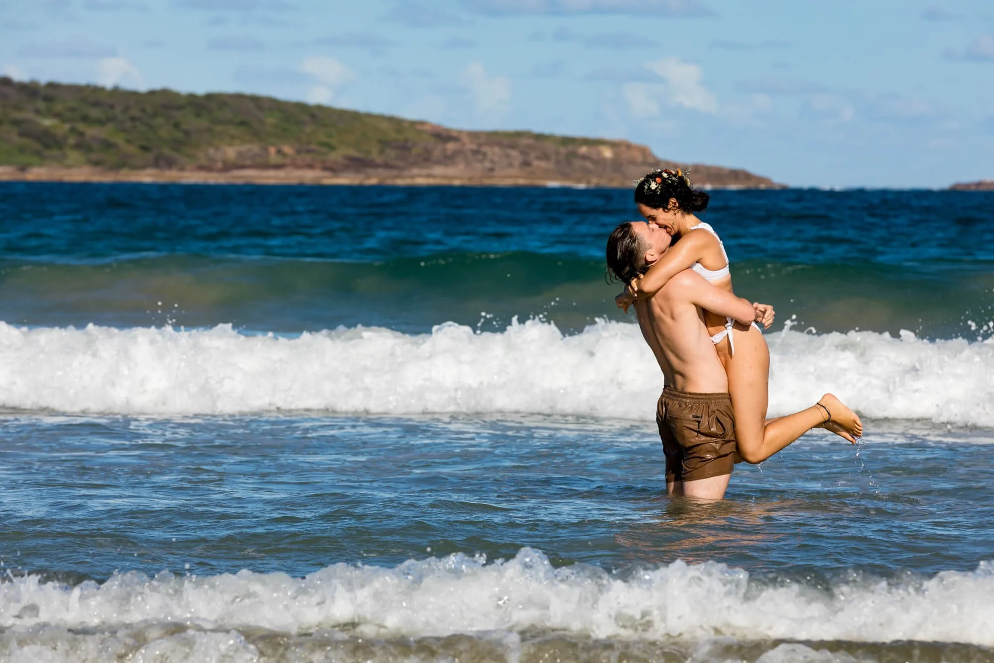 Couple swimming on their wedding day