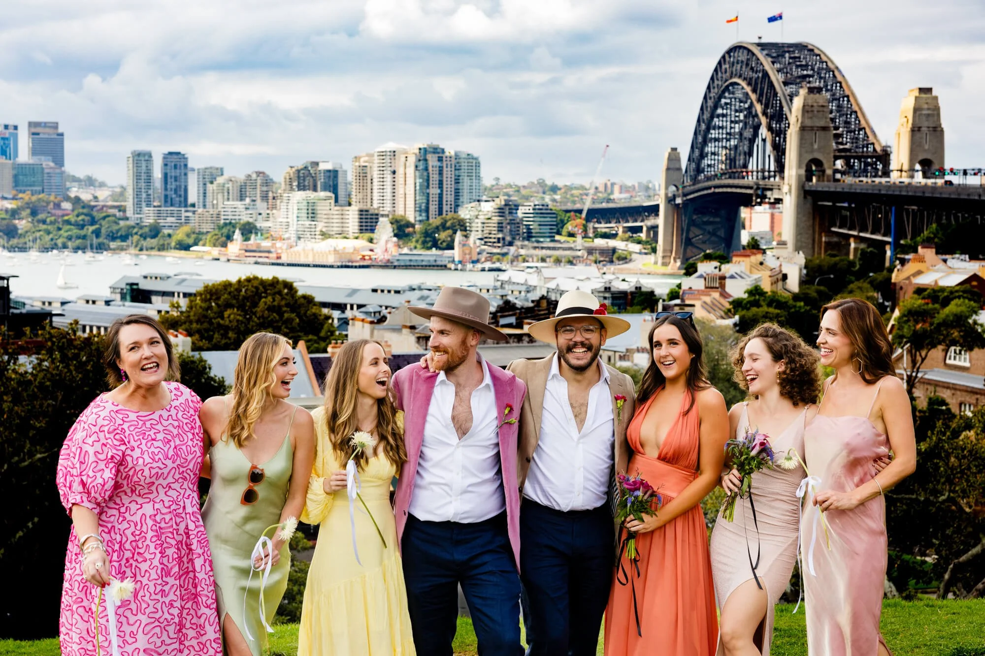 Gay couple with bridal entourage