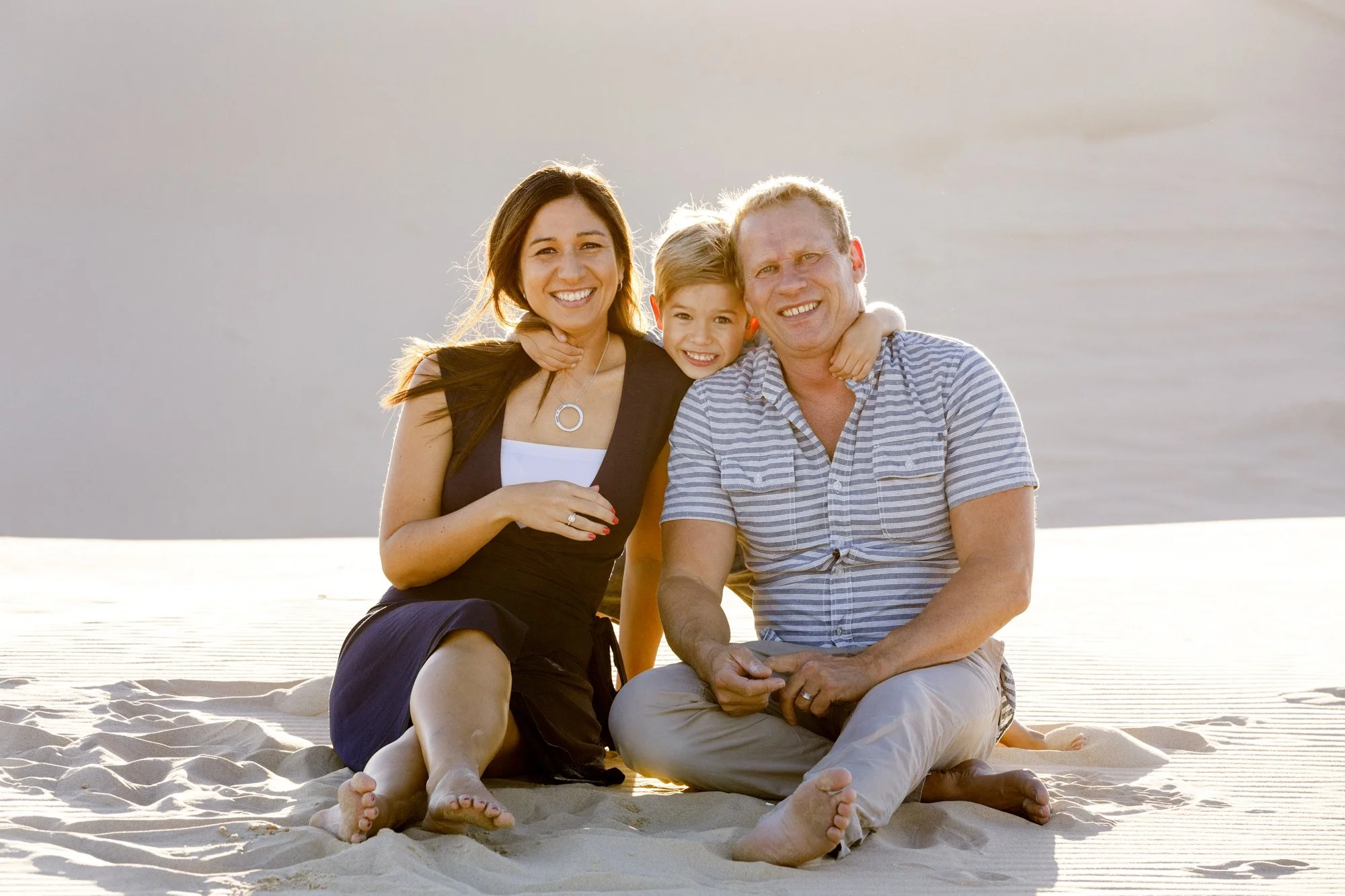 Family of three in the sand dunes, Anna Bay, Port Stephens