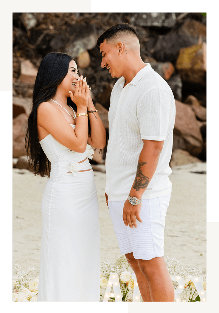 A young man marriage proposal to his girlfriend on Dutchmans Beach, Nelson Bay, Port Stephens