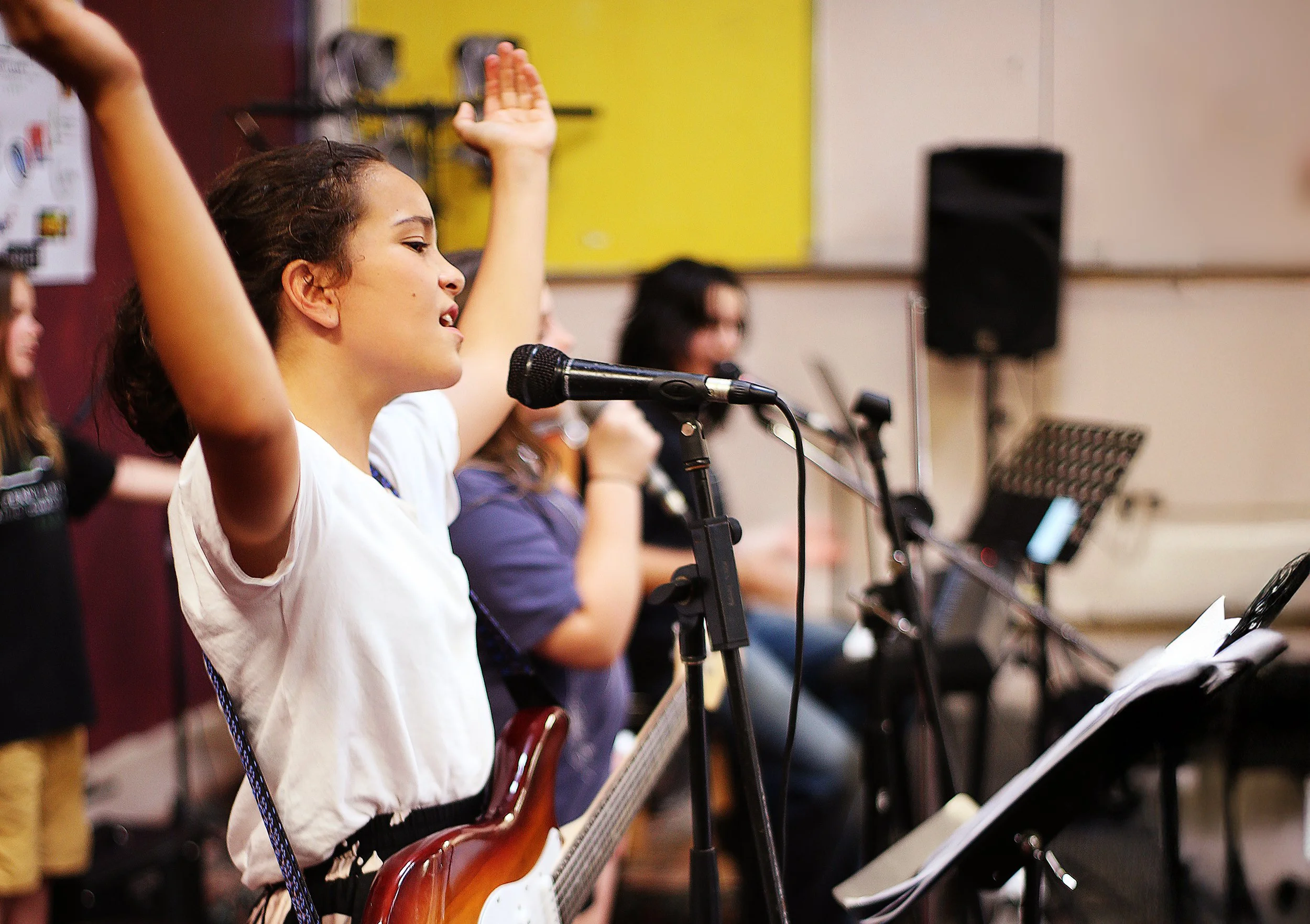 young-musician-clapping-hands-on-stage.jpg