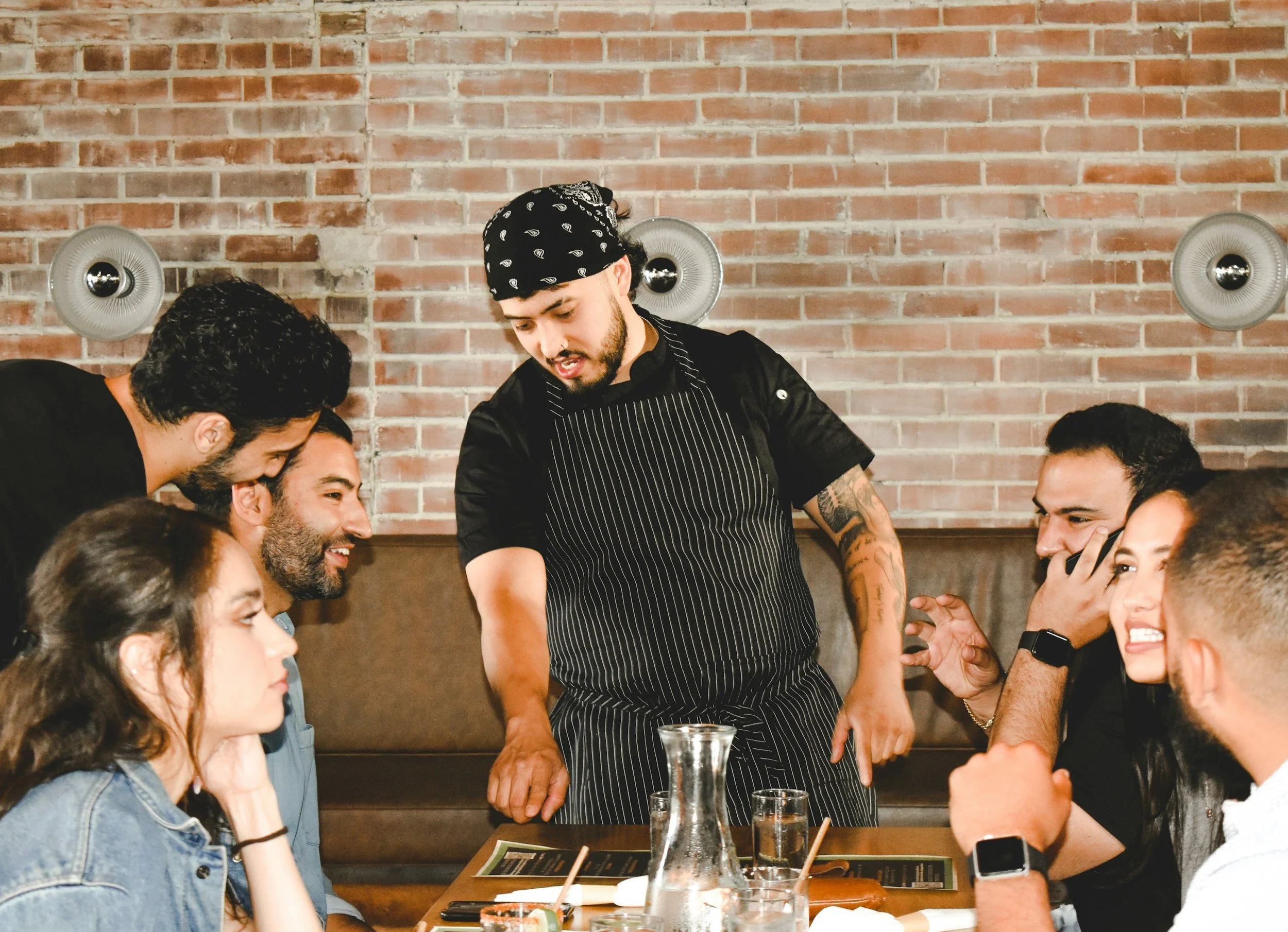 Smiling staff serving delicious brunch in a restaurant.