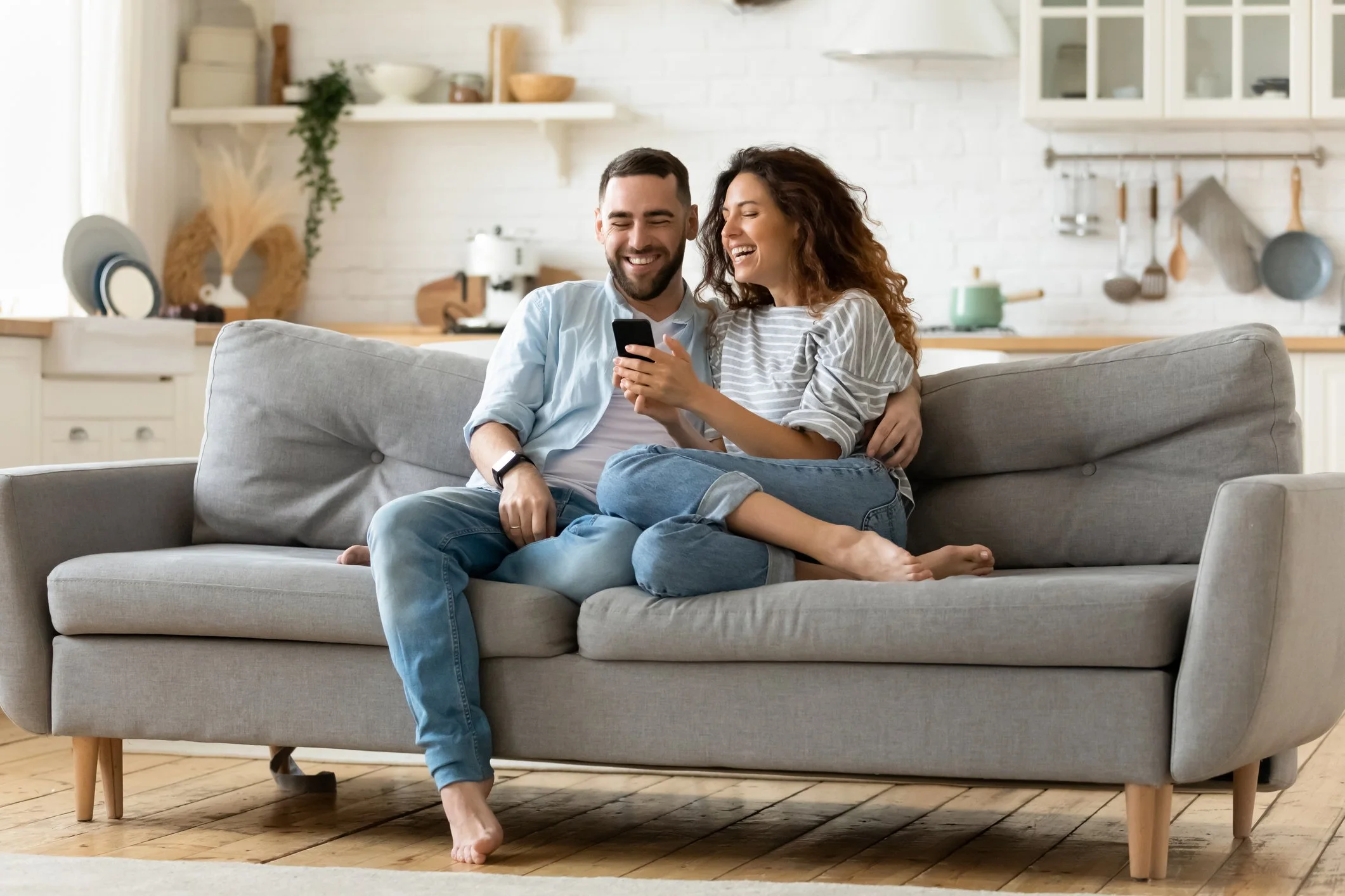 Couples sitting on the sofa starting to talk to each other after therapy