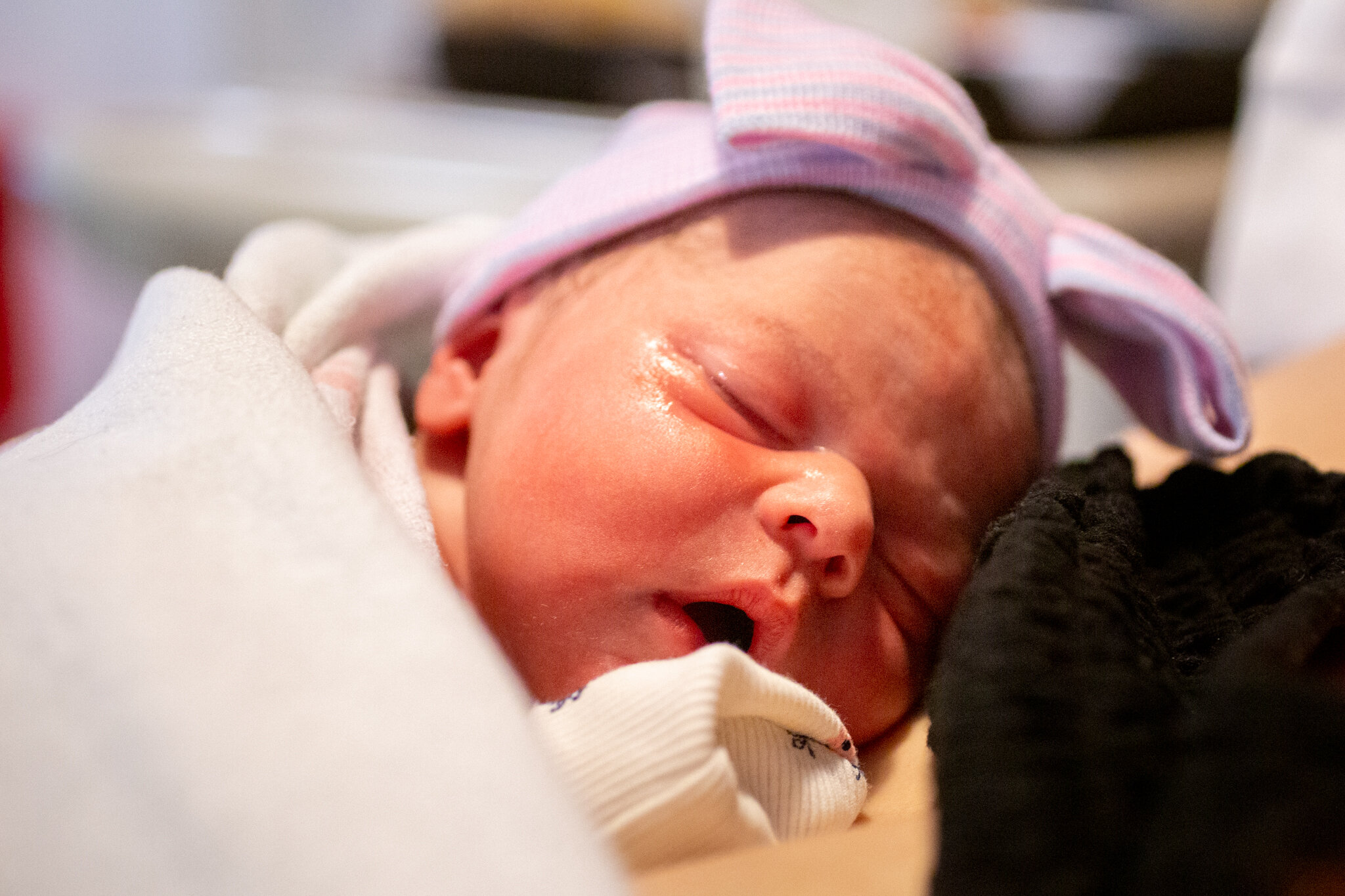 Newborn baby sleeping on mom's chest