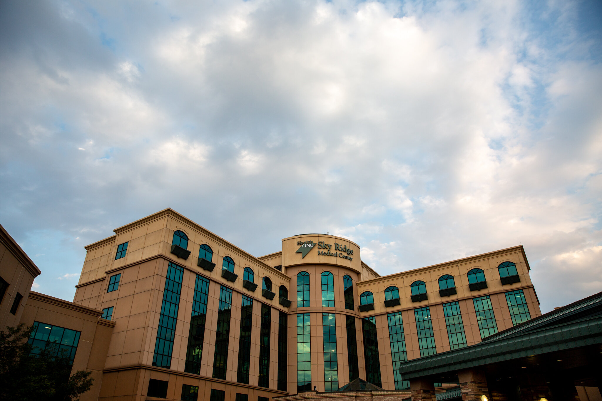 The front entrance of a hospital on a nice day