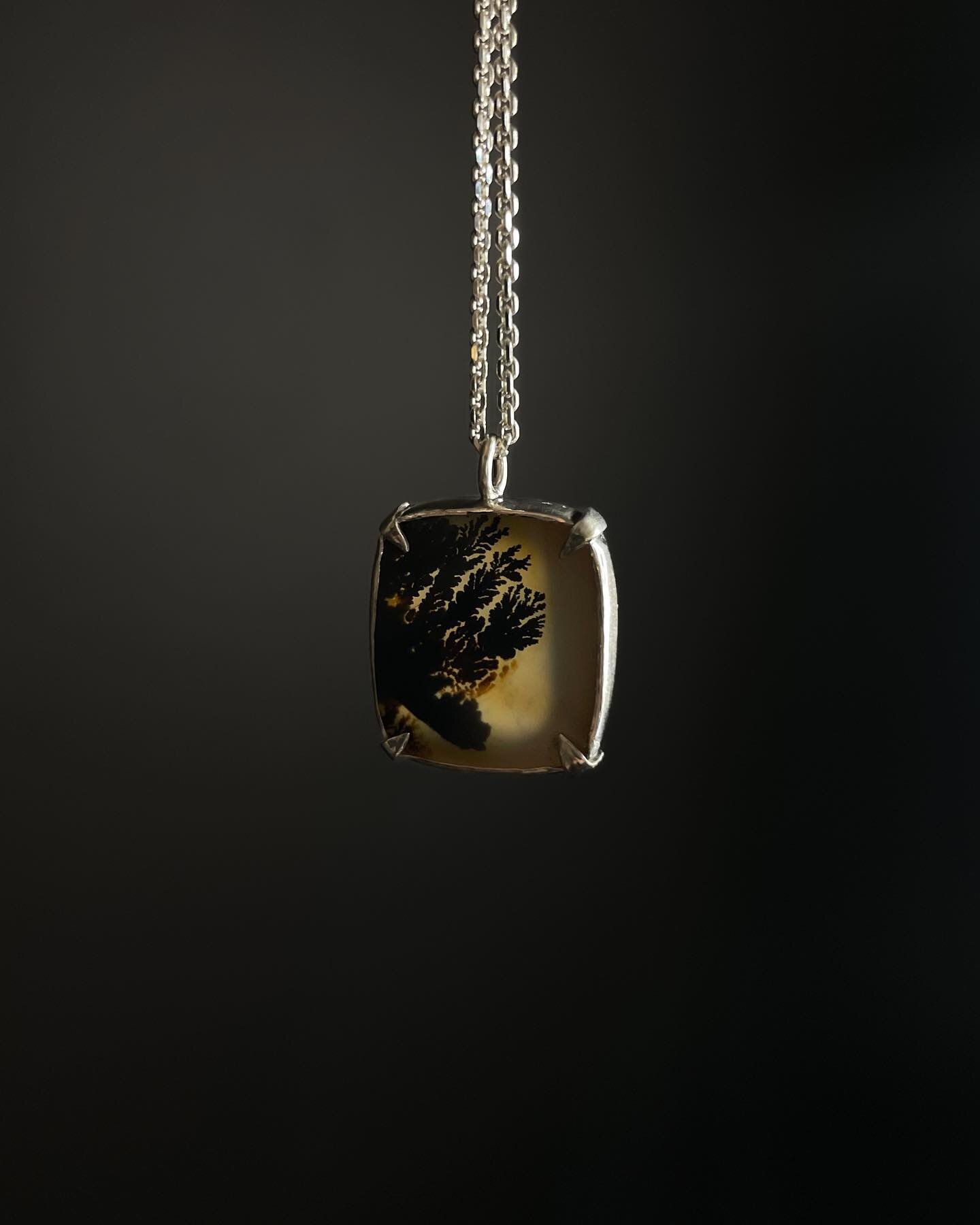 Swipe-&gt; &ldquo;Dark Tree Root&rdquo; Silver Necklace. Please tap the image to view the product tags, and tap a product tag to checkout on my website. 

This dendritic agate is set in fine silver with sterling prongs. It has a window cut out on the