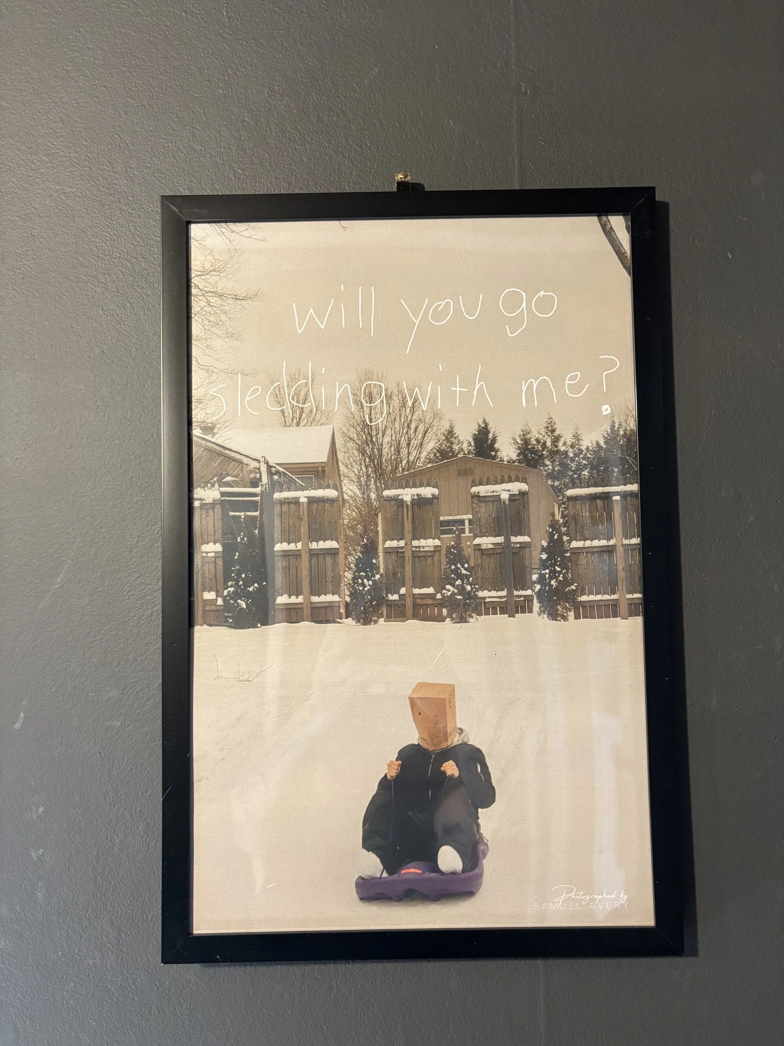 "Paper Bag Boy" Sledding Framed Print