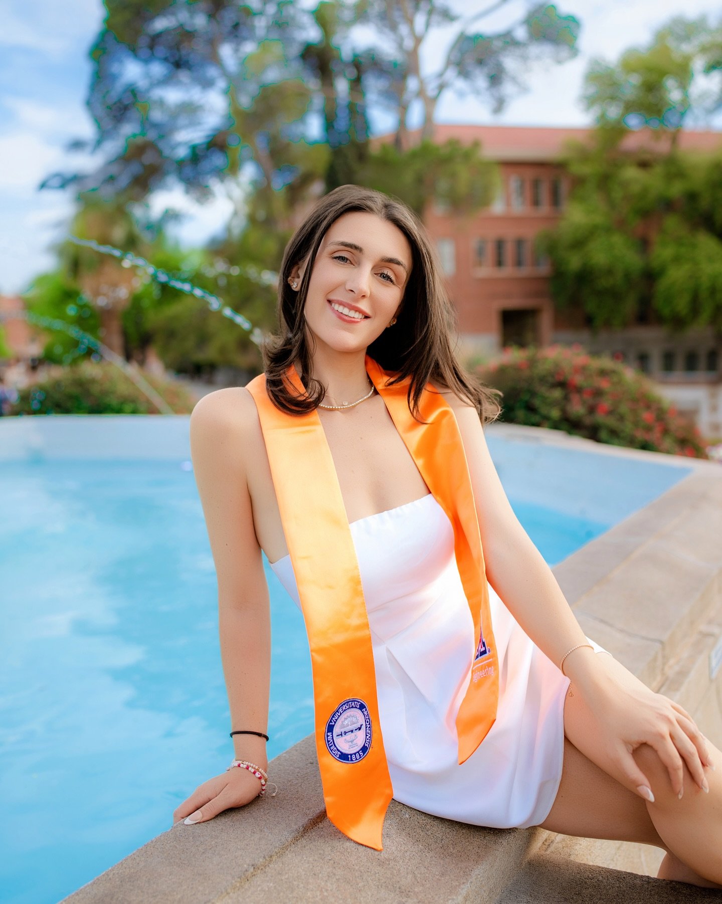@madisonmigliori made the U of A campus her runway. β¨π This first set kicks things off where it all began: the iconic fountain, her orange stole, and the confidence of someone who earned every step forward. There’s more to come, but this momen