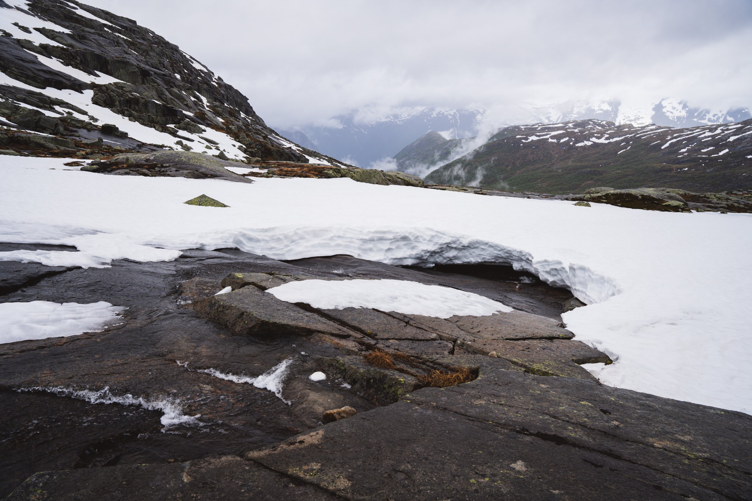 Stream flowing through the snow pack