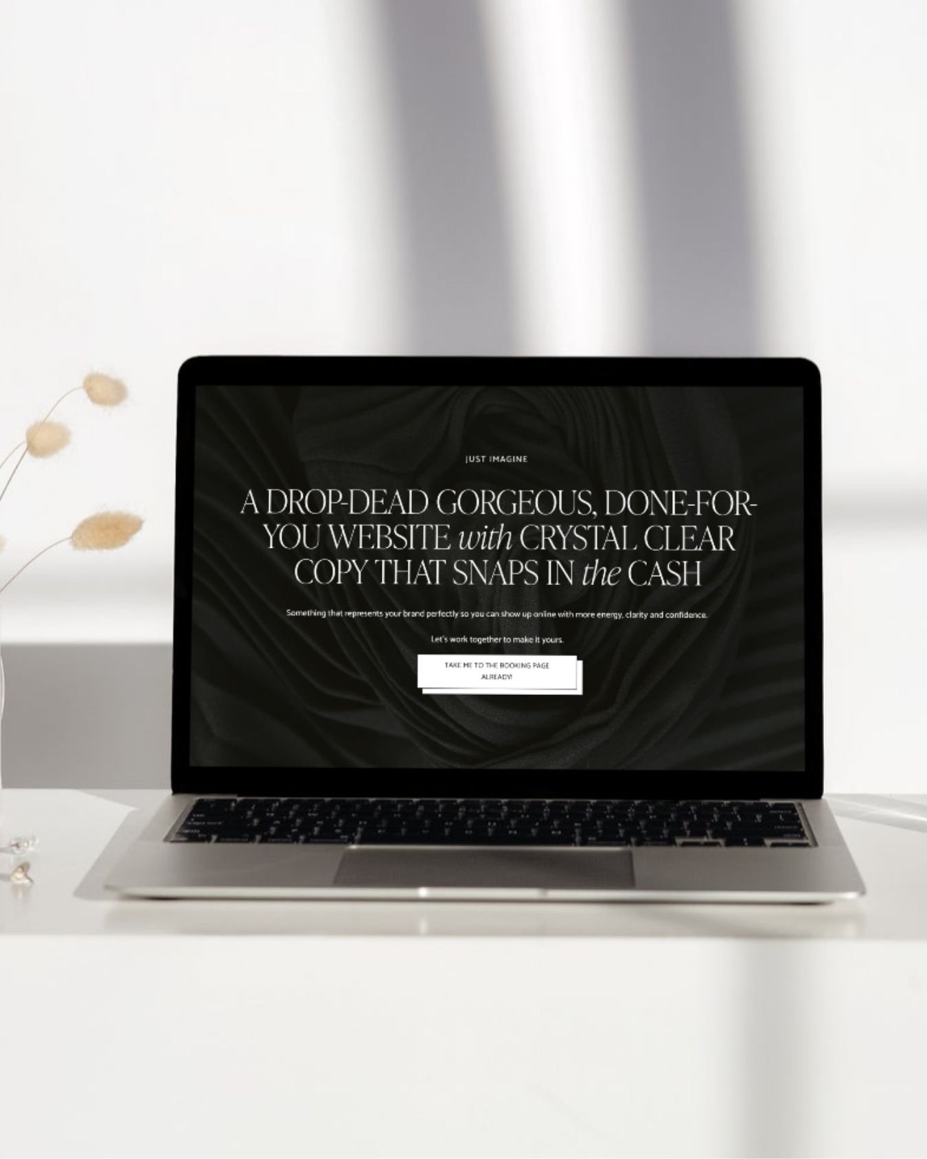 Website copy example on the screen of an open laptop in a comfortable setting that Sarah Marriott wrote for Elisabeth Barnes